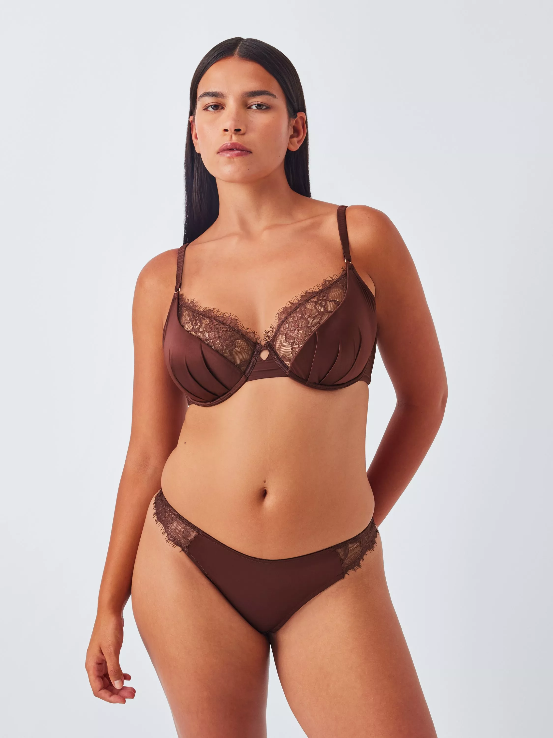 Woman wearing a brown bra and knicker matching set