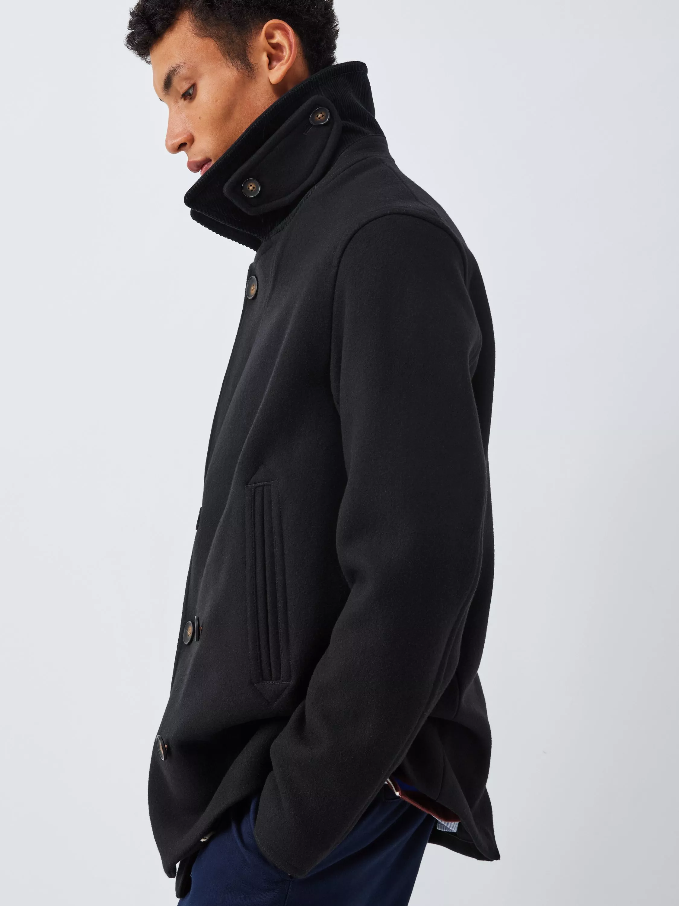 Man wearing a black coat