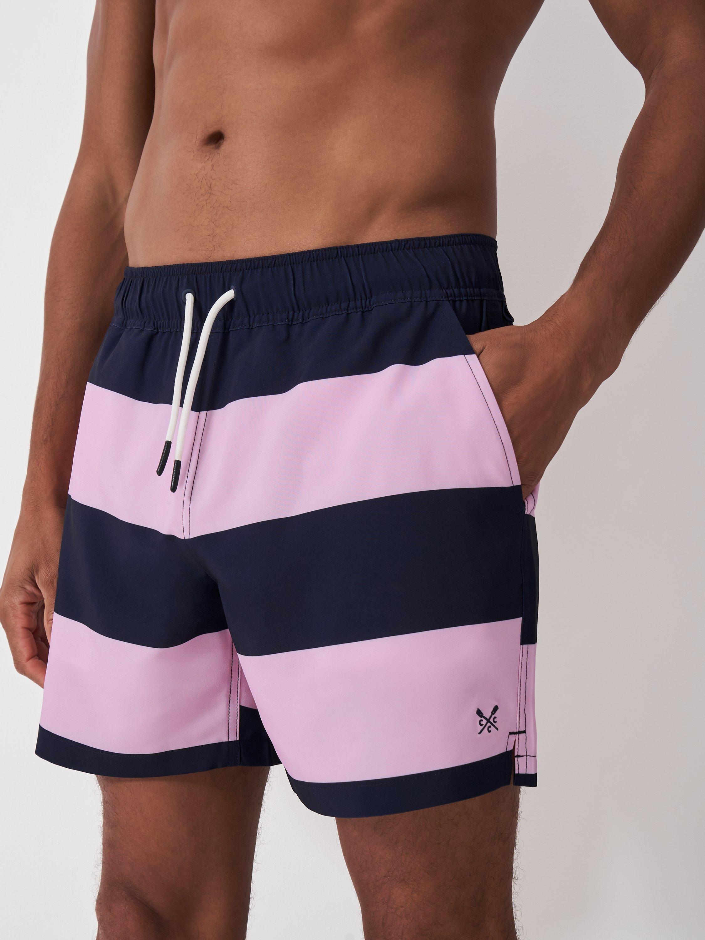 Product image 1 of 4, which shows Crew Clothing Broad Stripe Swim Shorts, Navy/Pink, XS