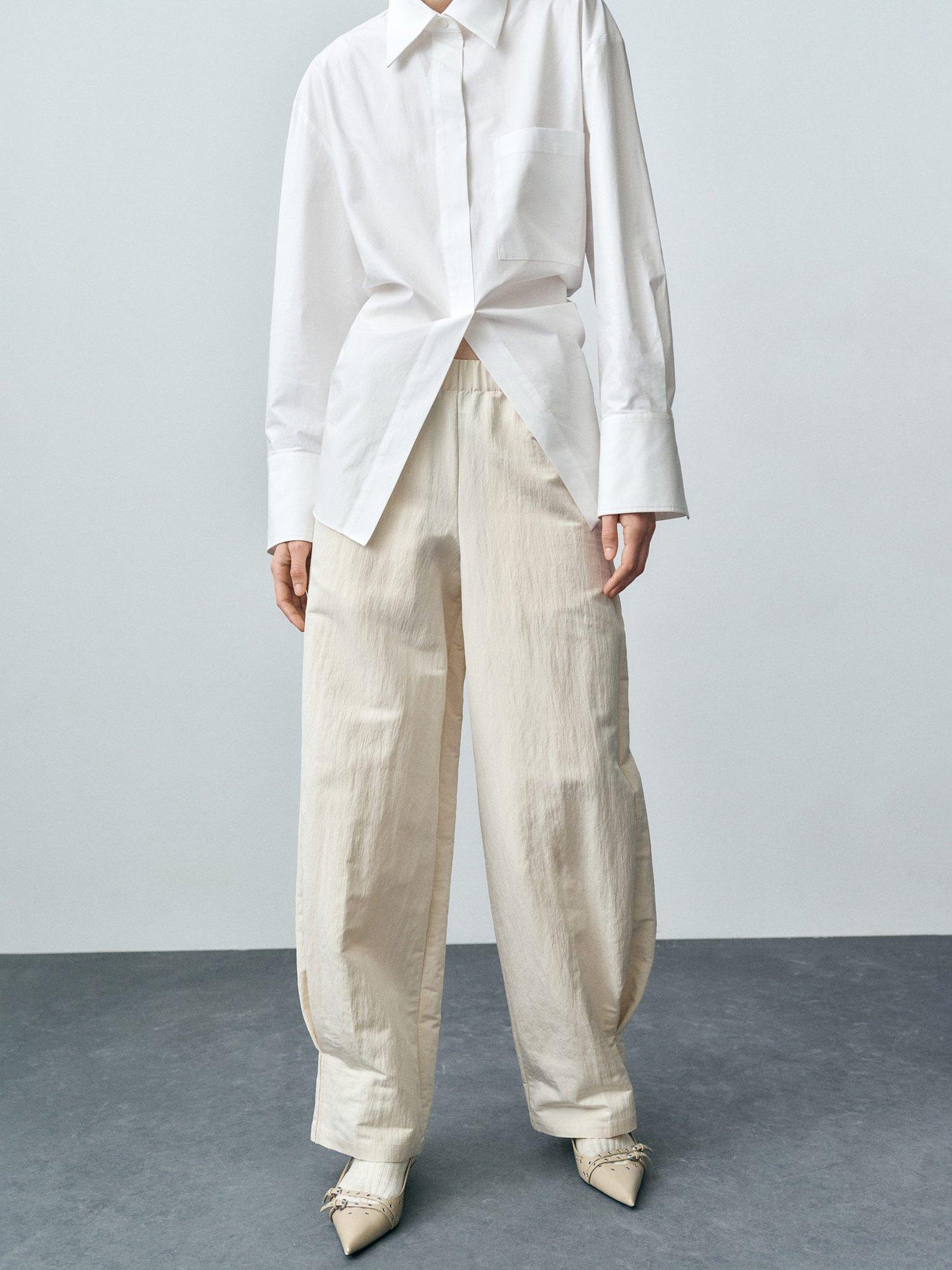 Product image 1 of 7, which shows Mango Alba Elasticated Waist Balloon Leg Trousers, Cream, 10