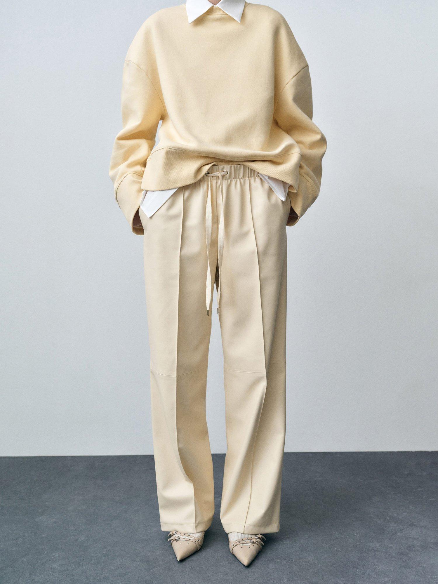 Product image 1 of 8, which shows Mango Nathalia Wide Leg Faux Leather Trousers, Cream, 10