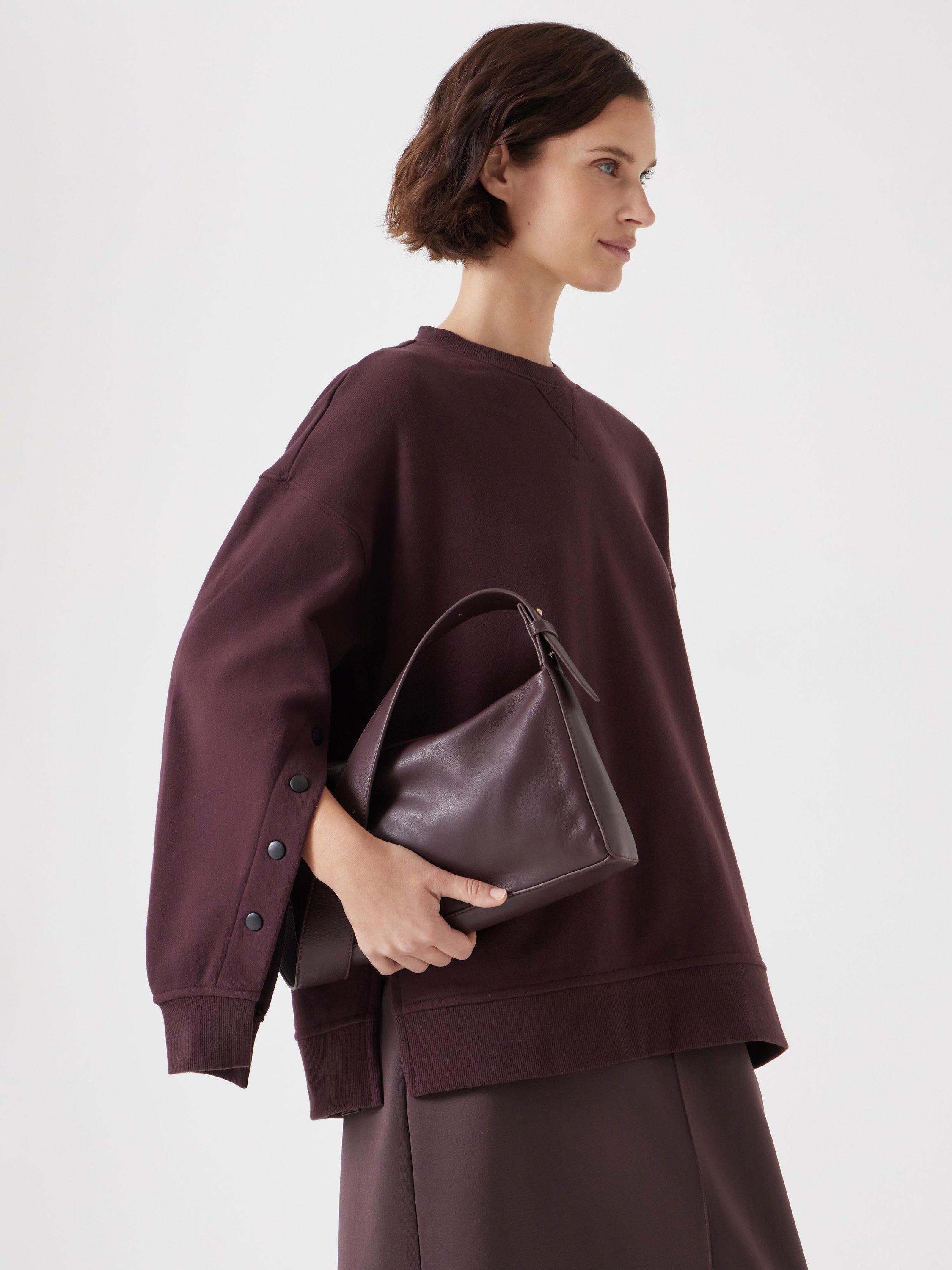 Product image 2 of 5, which shows HUSH Cleo Leather Crossbody Bag, Burgundy Red