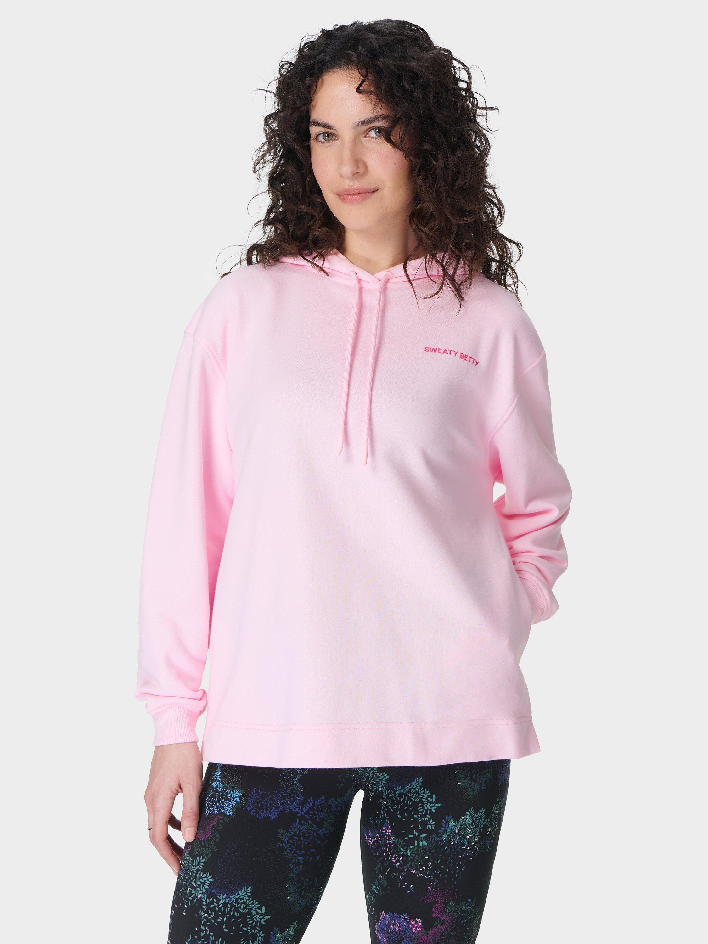 Product image 1 of 7, which shows Sweaty Betty Revive Longline Organic Cotton Rich Hoodie, Nerine Pink, L-XL
