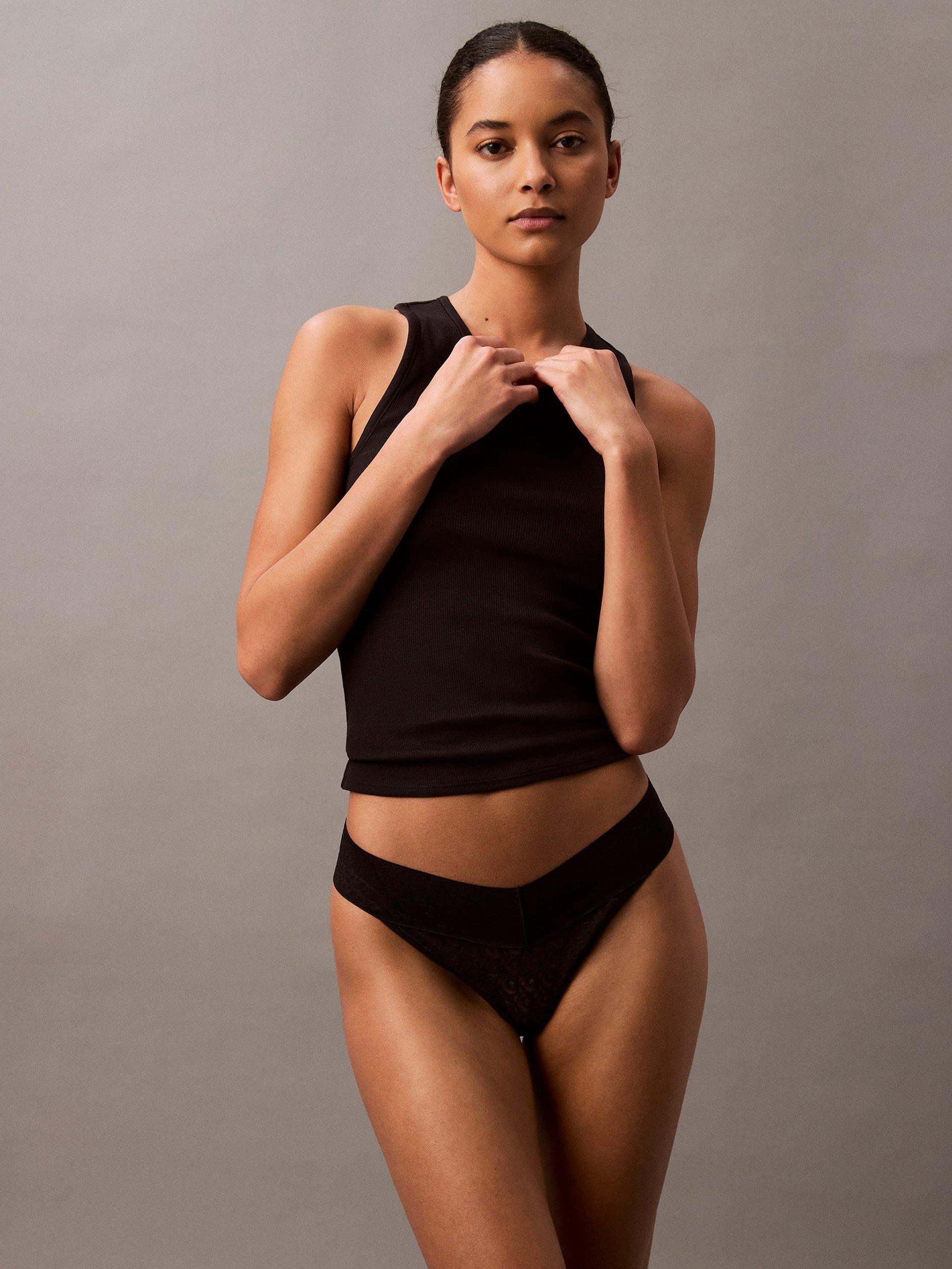 Product image 1 of 6, which shows Calvin Klein Lace Low-Rise Thong, Black, XS