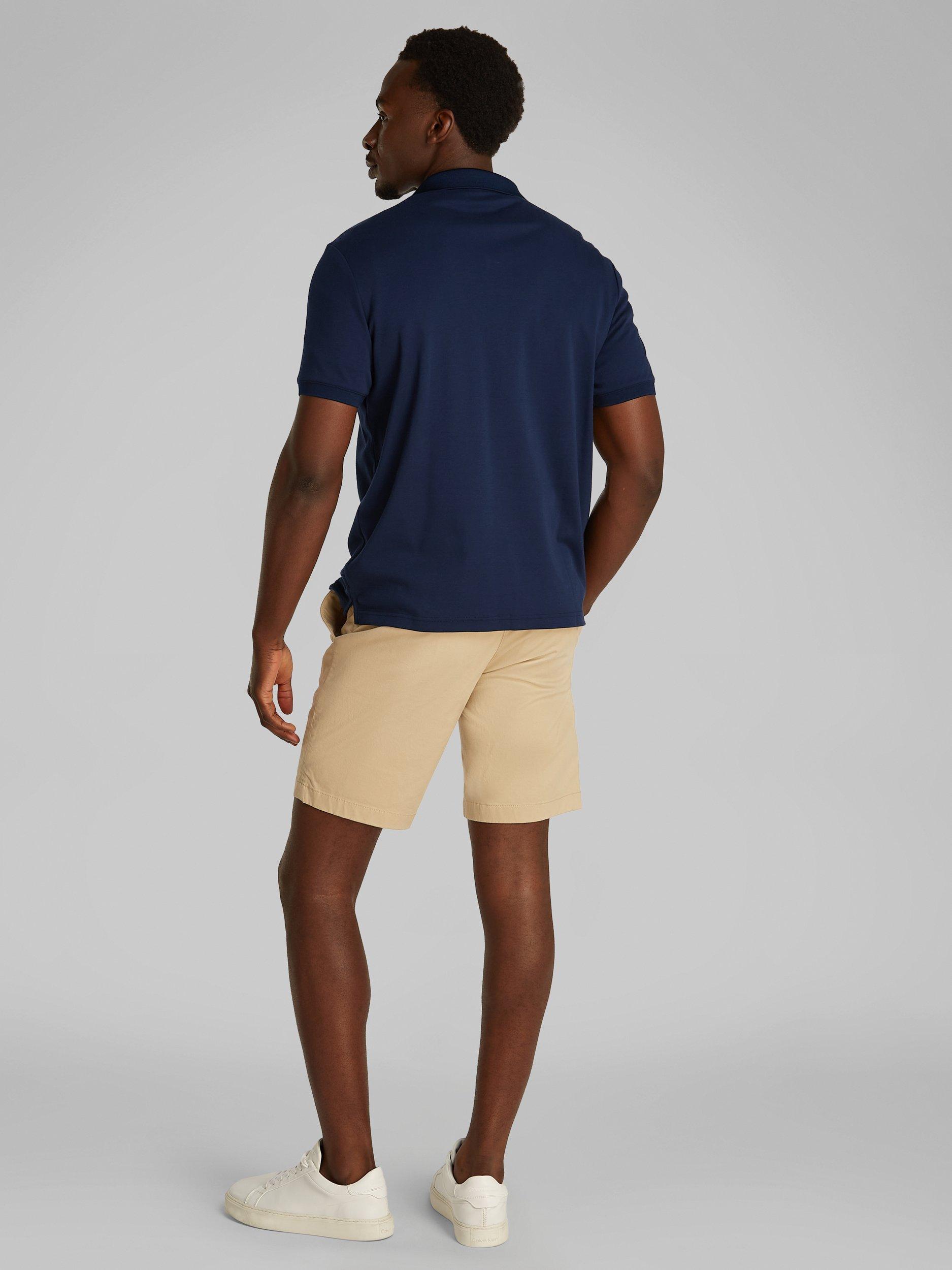 Product image 3 of 6, which shows Calvin Klein Organic Cotton Regular Fit Short Sleeve Zip Neck Polo Shirt, Dark Sapphire, XS