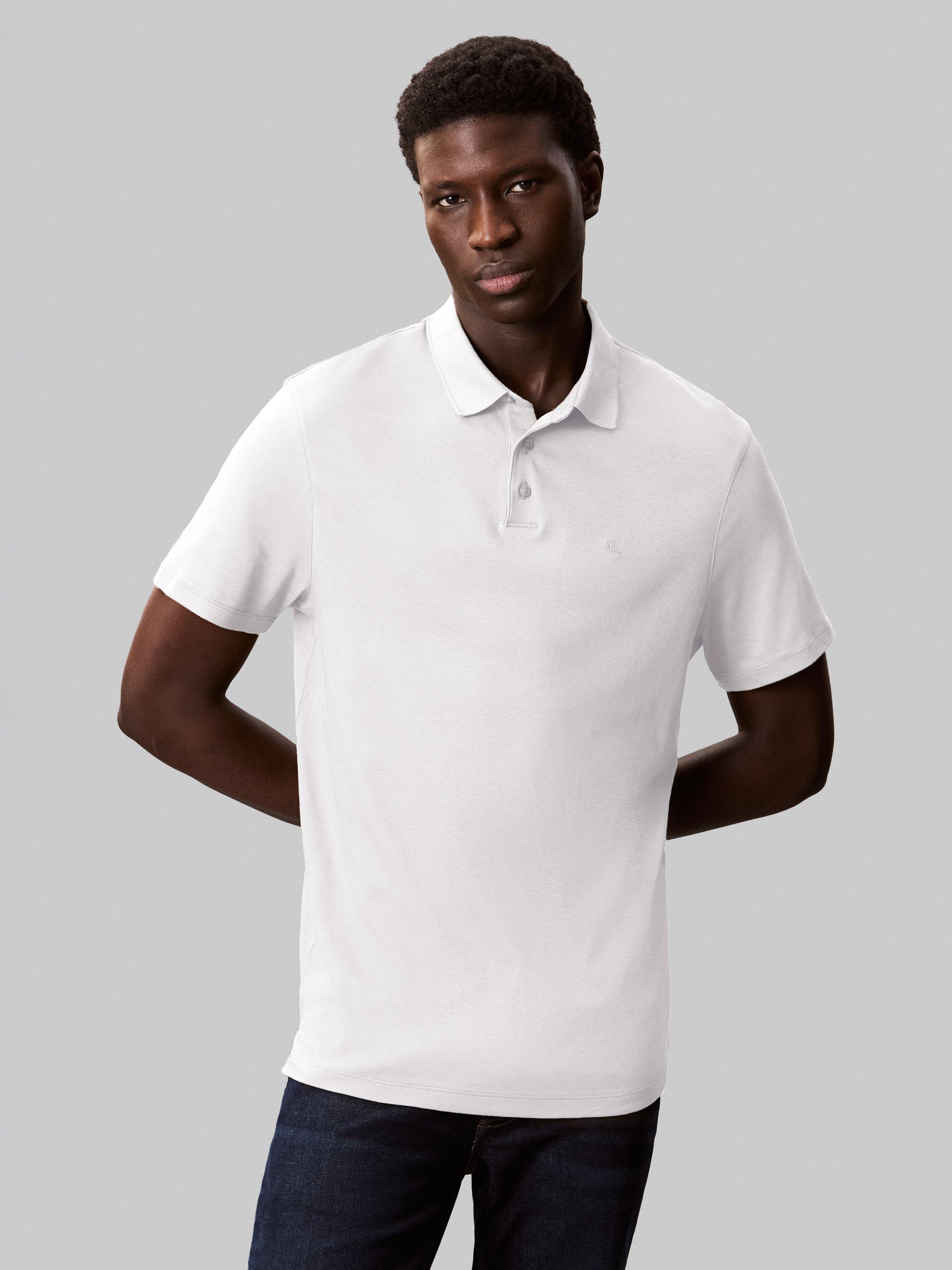 Product image 1 of 4, which shows Calvin Klein Cotton Regular Fit Short Sleeve Logo Polo Shirt, Bright White, XS
