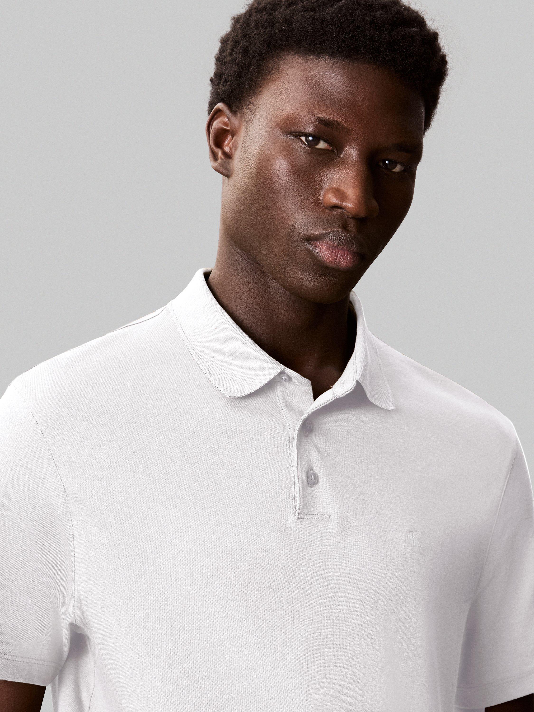 Product image 4 of 4, which shows Calvin Klein Cotton Regular Fit Short Sleeve Logo Polo Shirt, Bright White, XS