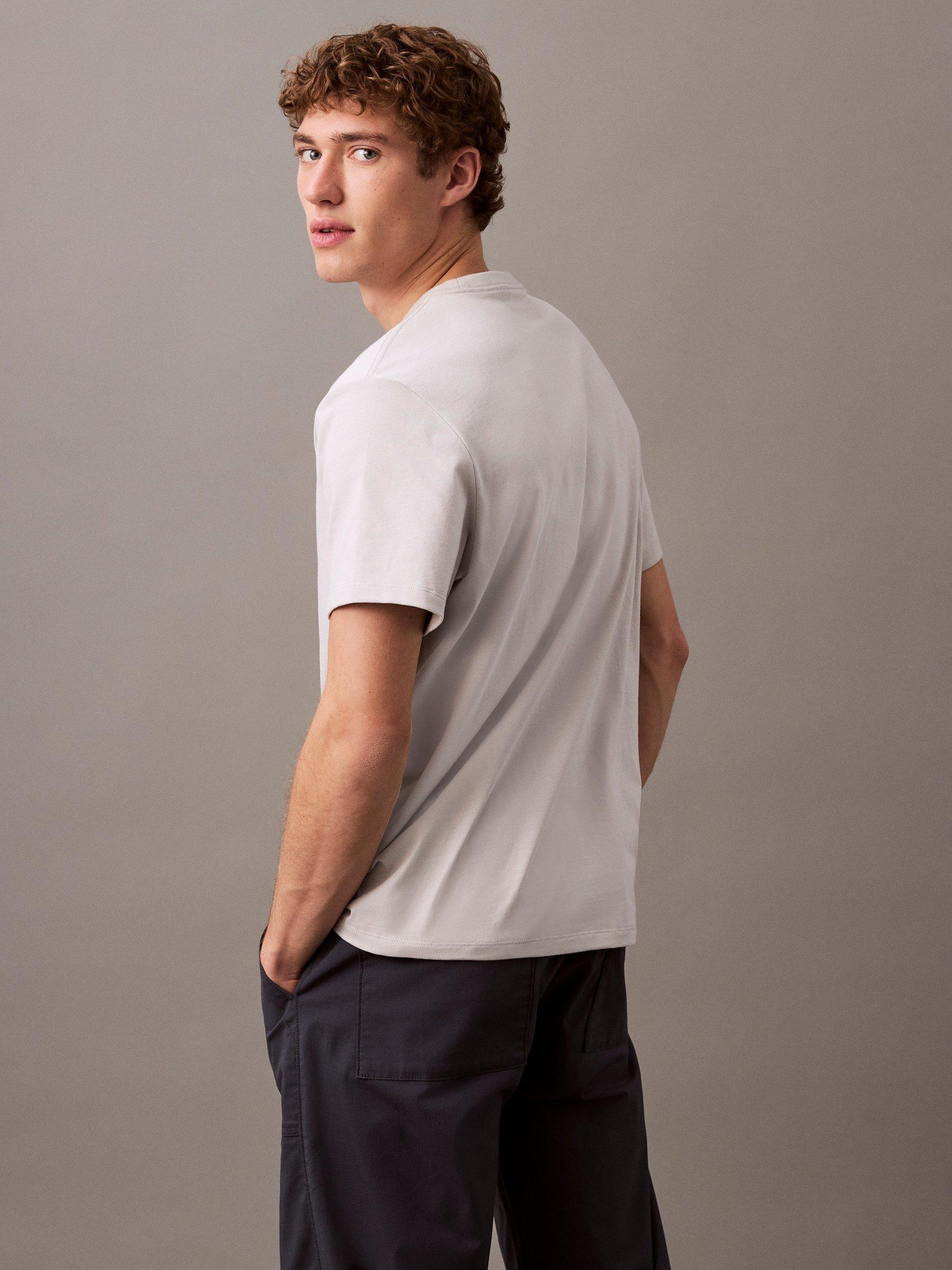 Product image 2 of 4, which shows Calvin Klein Cotton Regular Fit Short Sleeve Curve Logo T-Shirt, Gray Violet, XS
