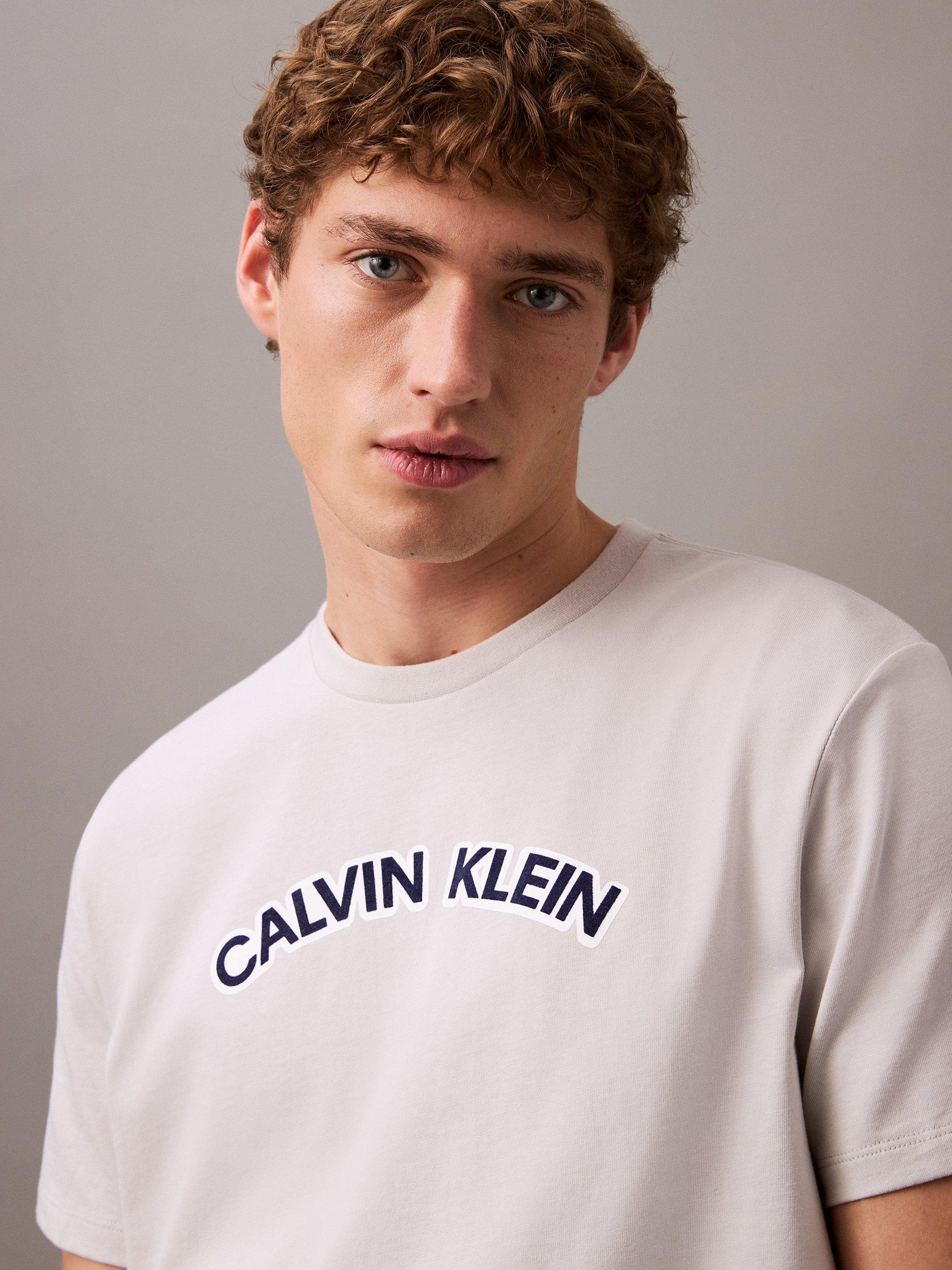 Product image 4 of 4, which shows Calvin Klein Cotton Regular Fit Short Sleeve Curve Logo T-Shirt, Gray Violet, XS