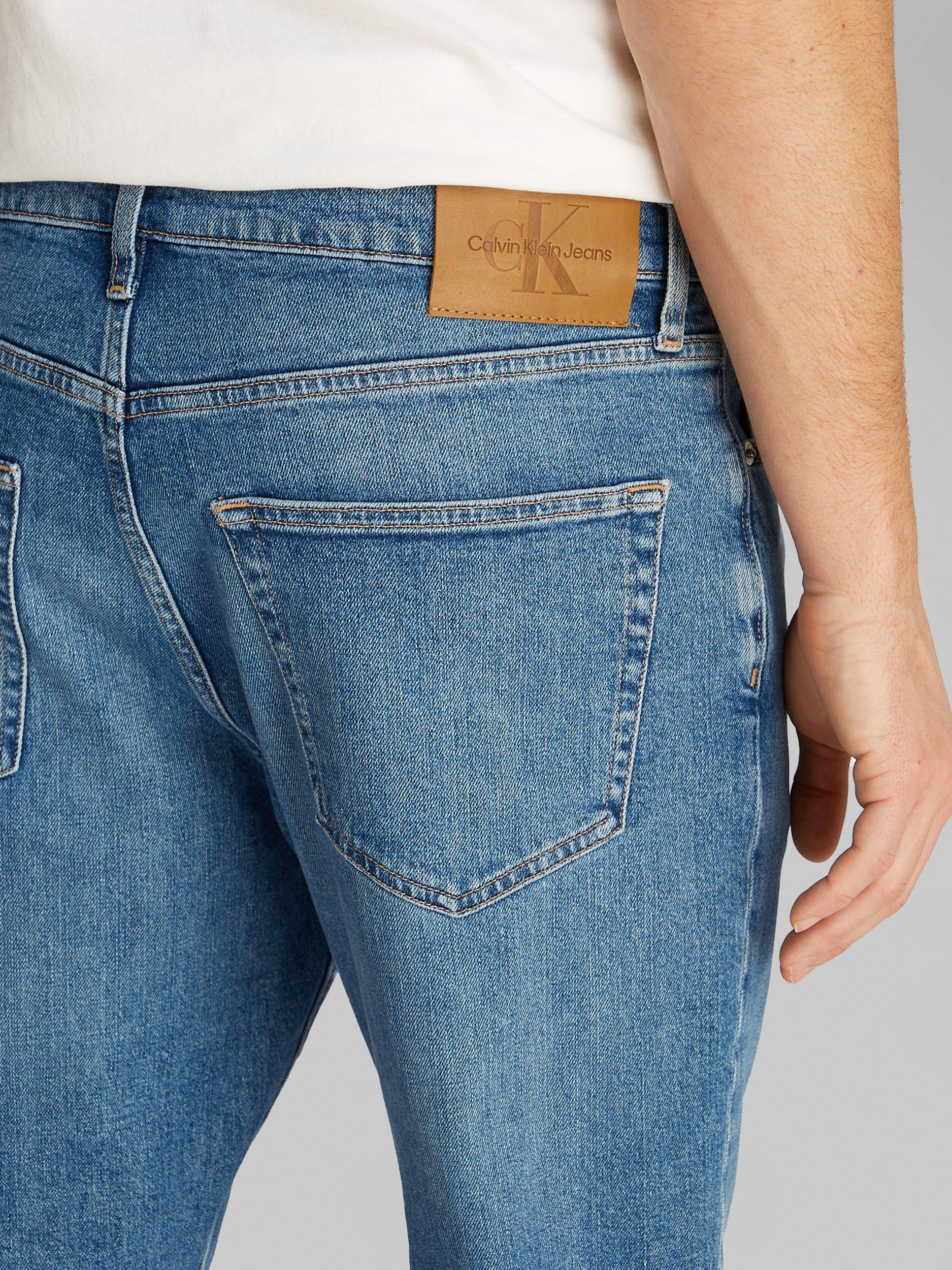 Product image 4 of 6, which shows Calvin Klein Tapered Dad Jeans, Denim Medium, 29R