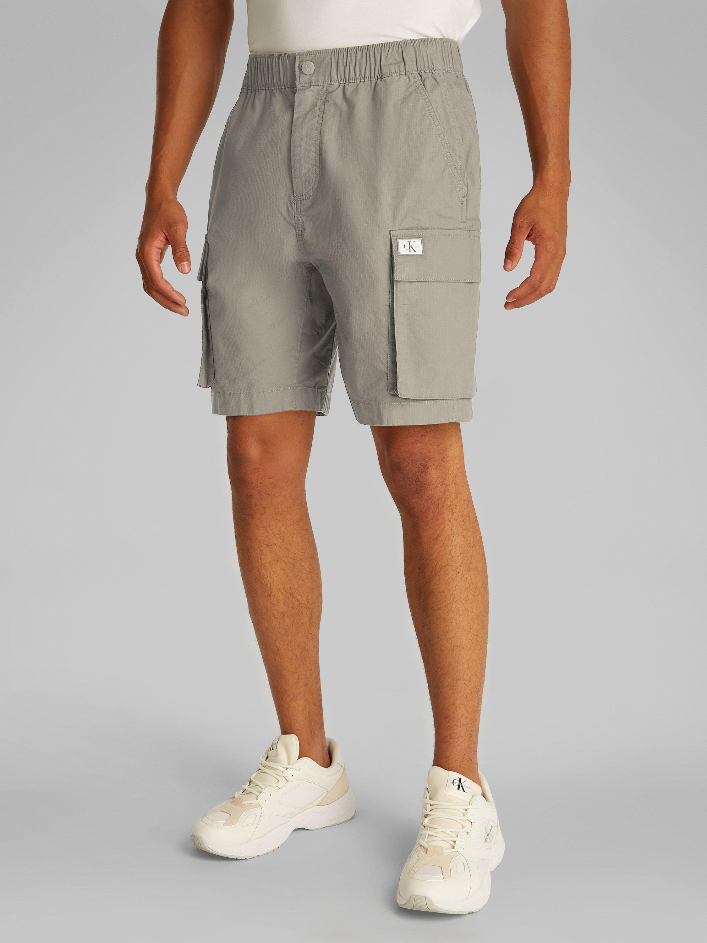 Product image 1 of 7, which shows Calvin Klein Jeans Cotton Blend Cargo Shorts, Laurel Oak, 28R