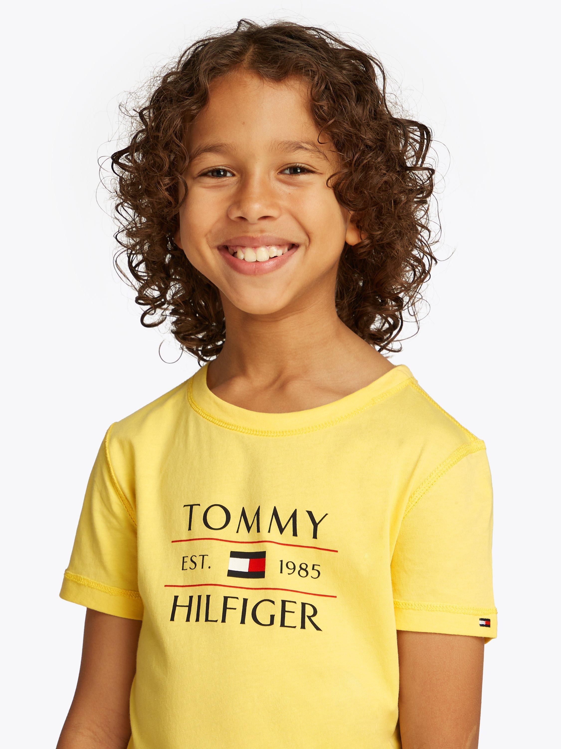 Product image 3 of 6, which shows Tommy Hilfiger Kids' Adaptive Collection Cotton Flag Logo T-Shirt, Citronella, 10 years