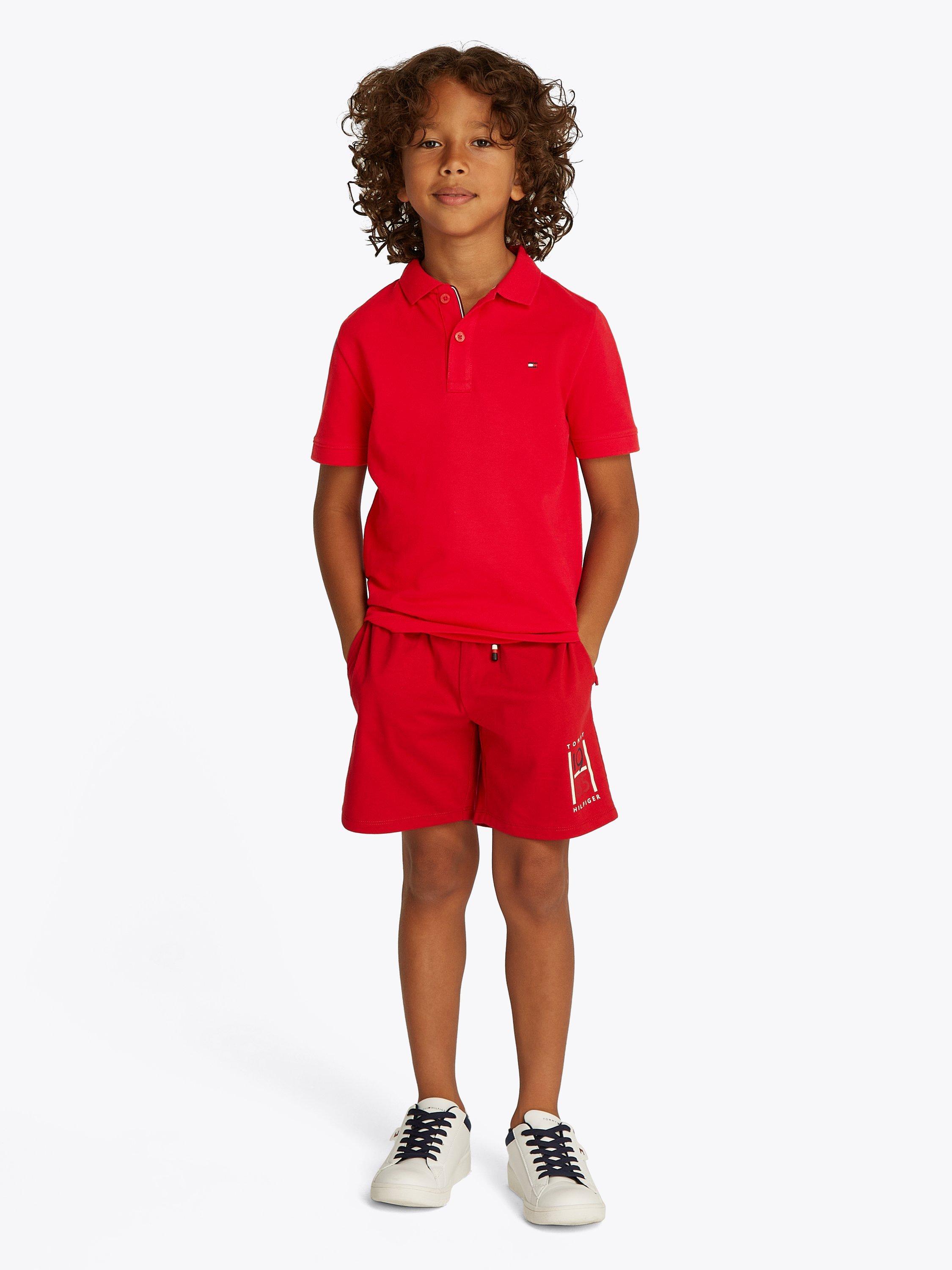 Product image 1 of 5, which shows Tommy Hilfiger Kids' Flag Short Sleeve Polo Shirt, Primary Red, 10 years