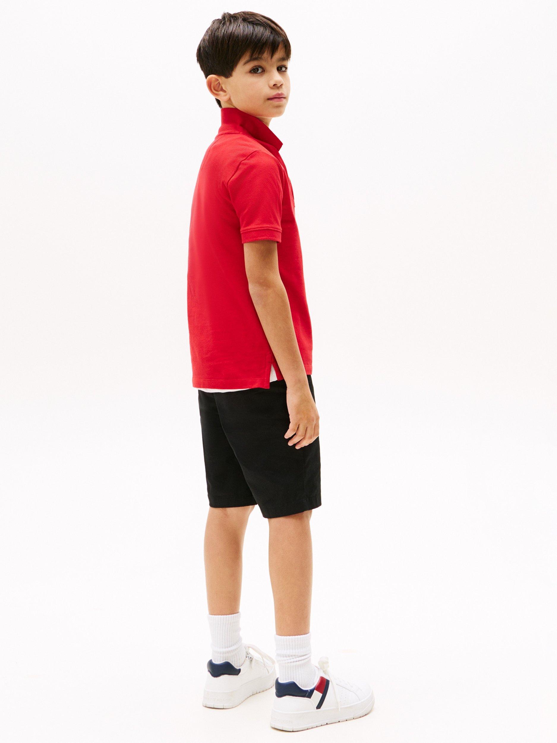 Product image 2 of 5, which shows Tommy Hilfiger Kids' Flag Short Sleeve Polo Shirt, Primary Red, 10 years