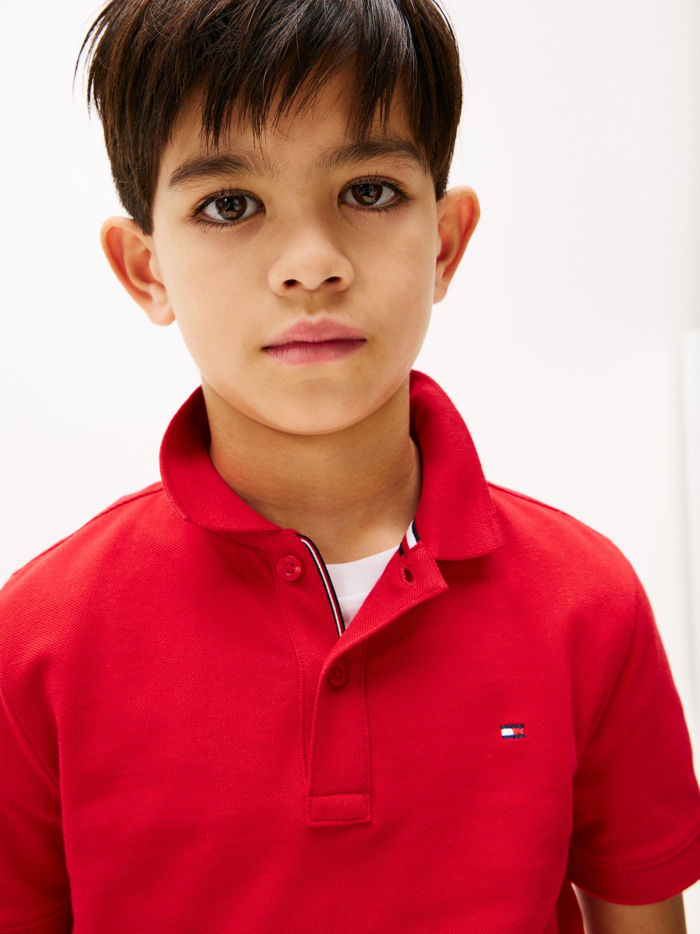 Product image 3 of 5, which shows Tommy Hilfiger Kids' Flag Short Sleeve Polo Shirt, Primary Red, 10 years