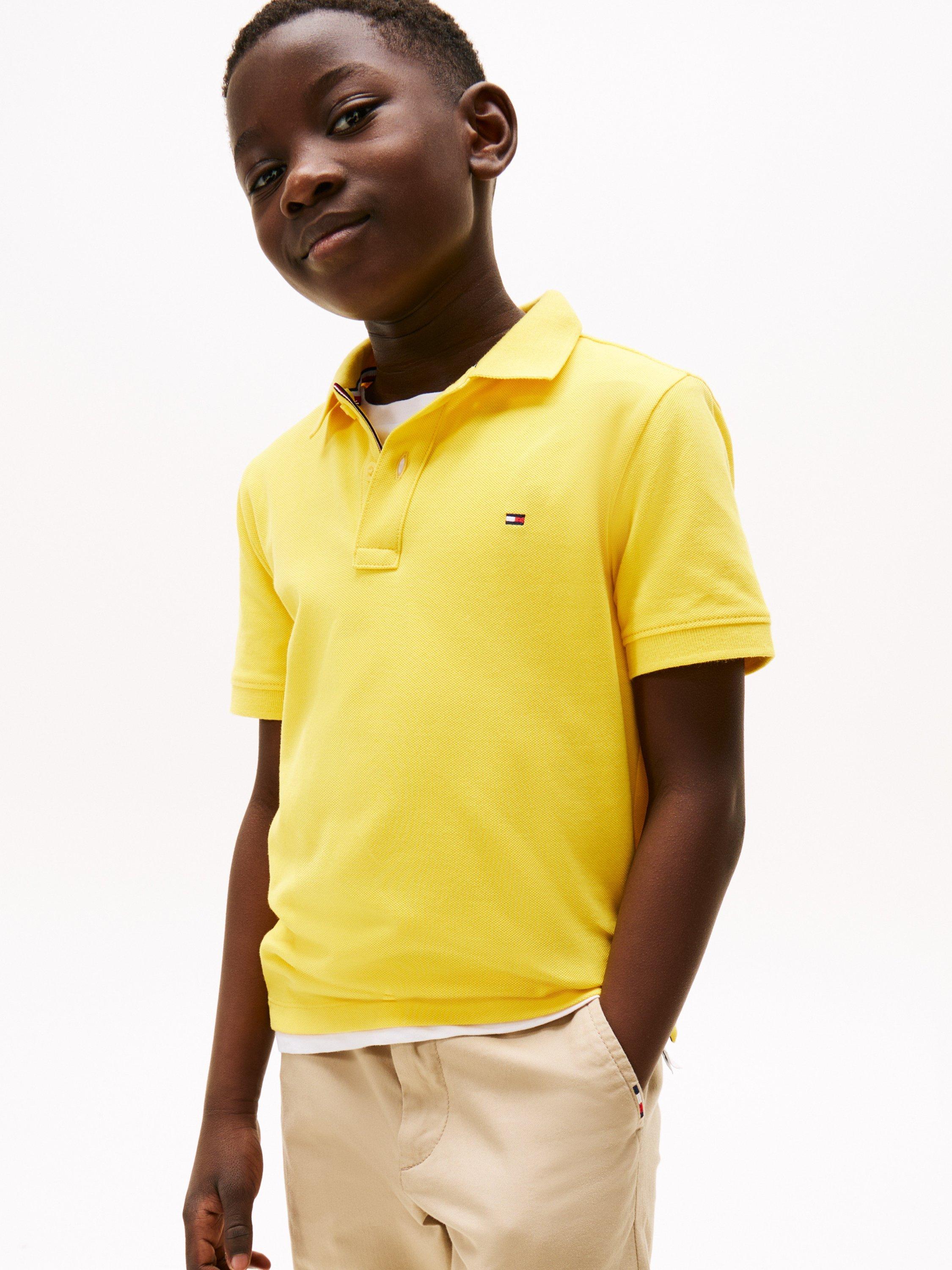 Product image 4 of 5, which shows Tommy Hilfiger Kids' Flag Short Sleeve Polo Shirt, Star Fruit Yellow, 16 years