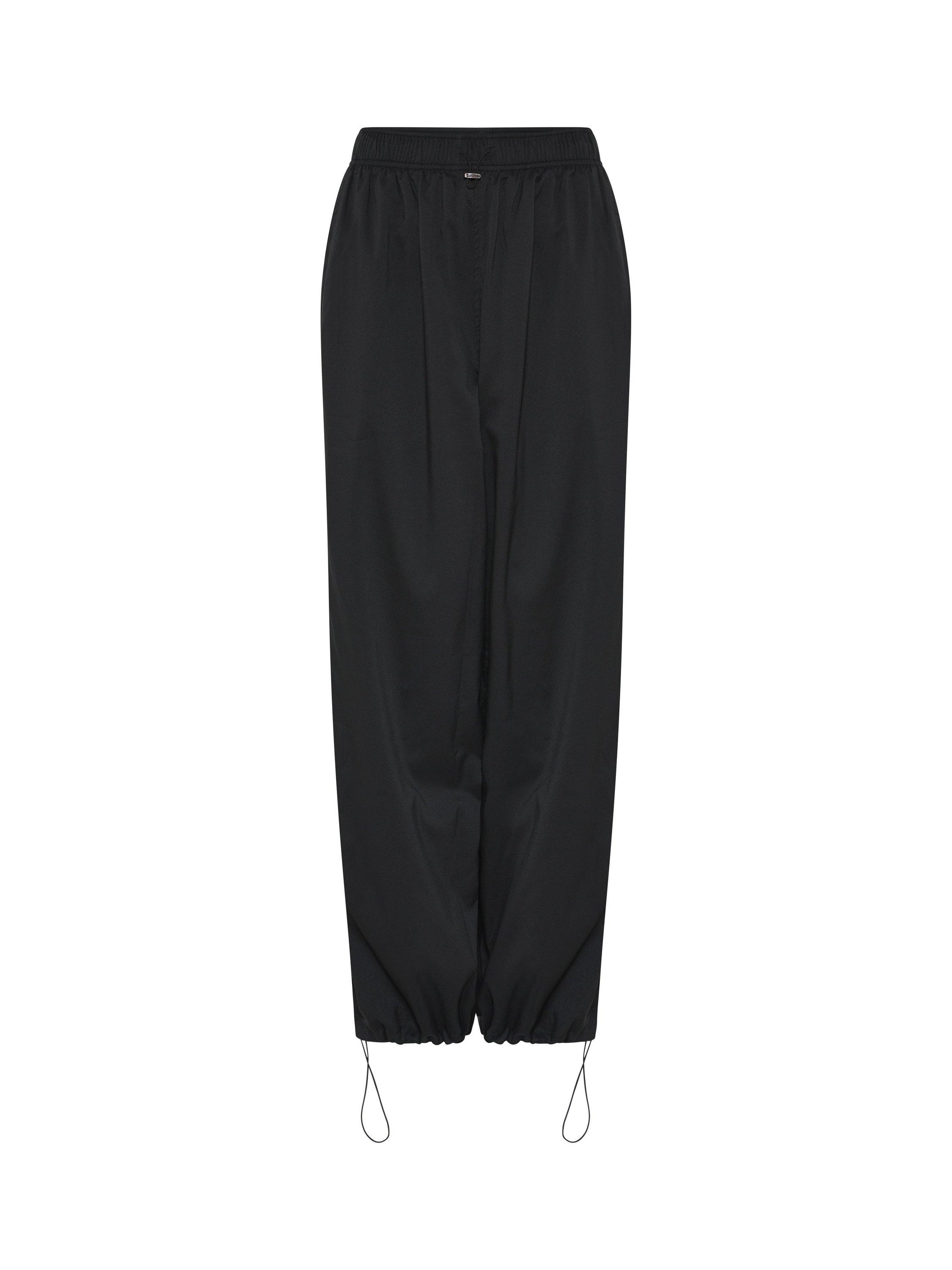 Product image 7 of 10, which shows Girlfriend Collective Amy Adjustable Trousers, Black, XS