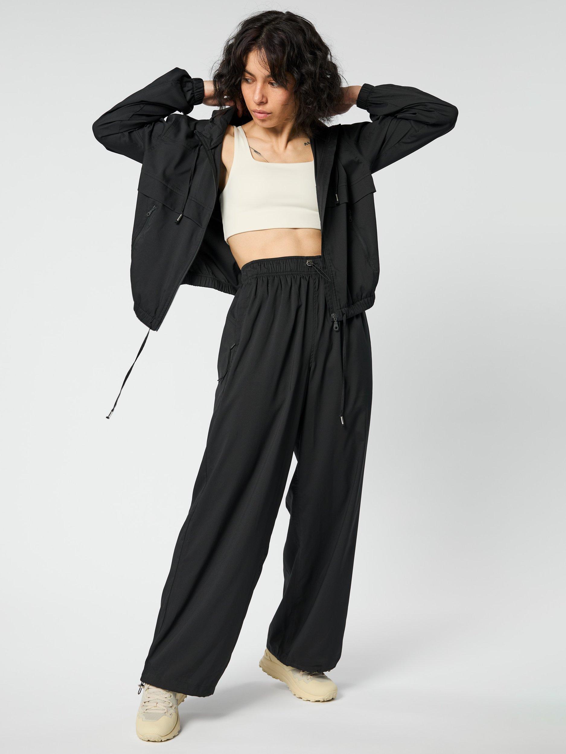 Product image 8 of 10, which shows Girlfriend Collective Amy Adjustable Trousers, Black, XS