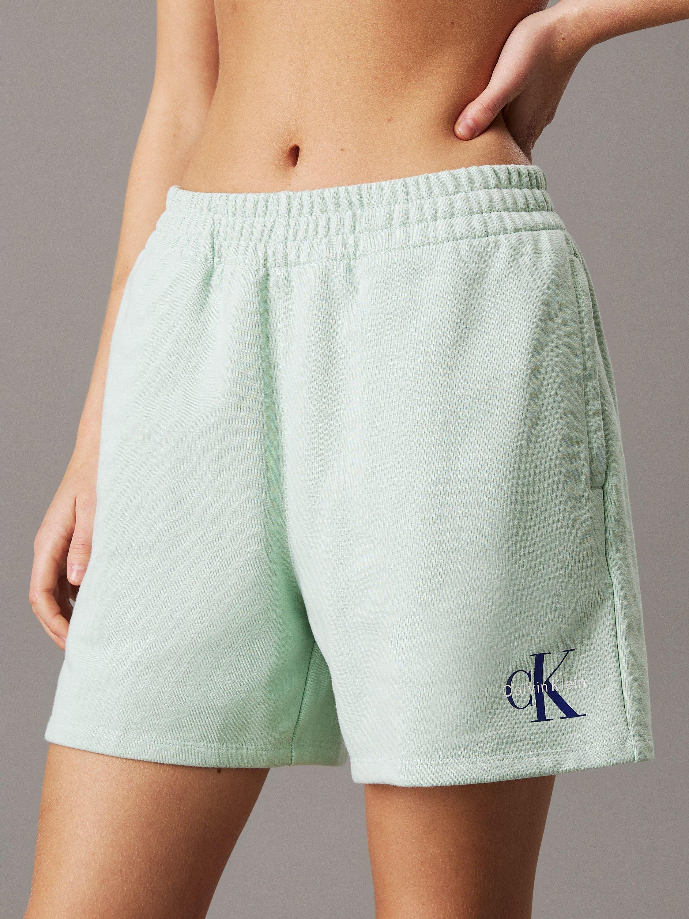 Product image 1 of 5, which shows Calvin Klein Mono Logo Jogger Shorts, Cameo Green, XXS