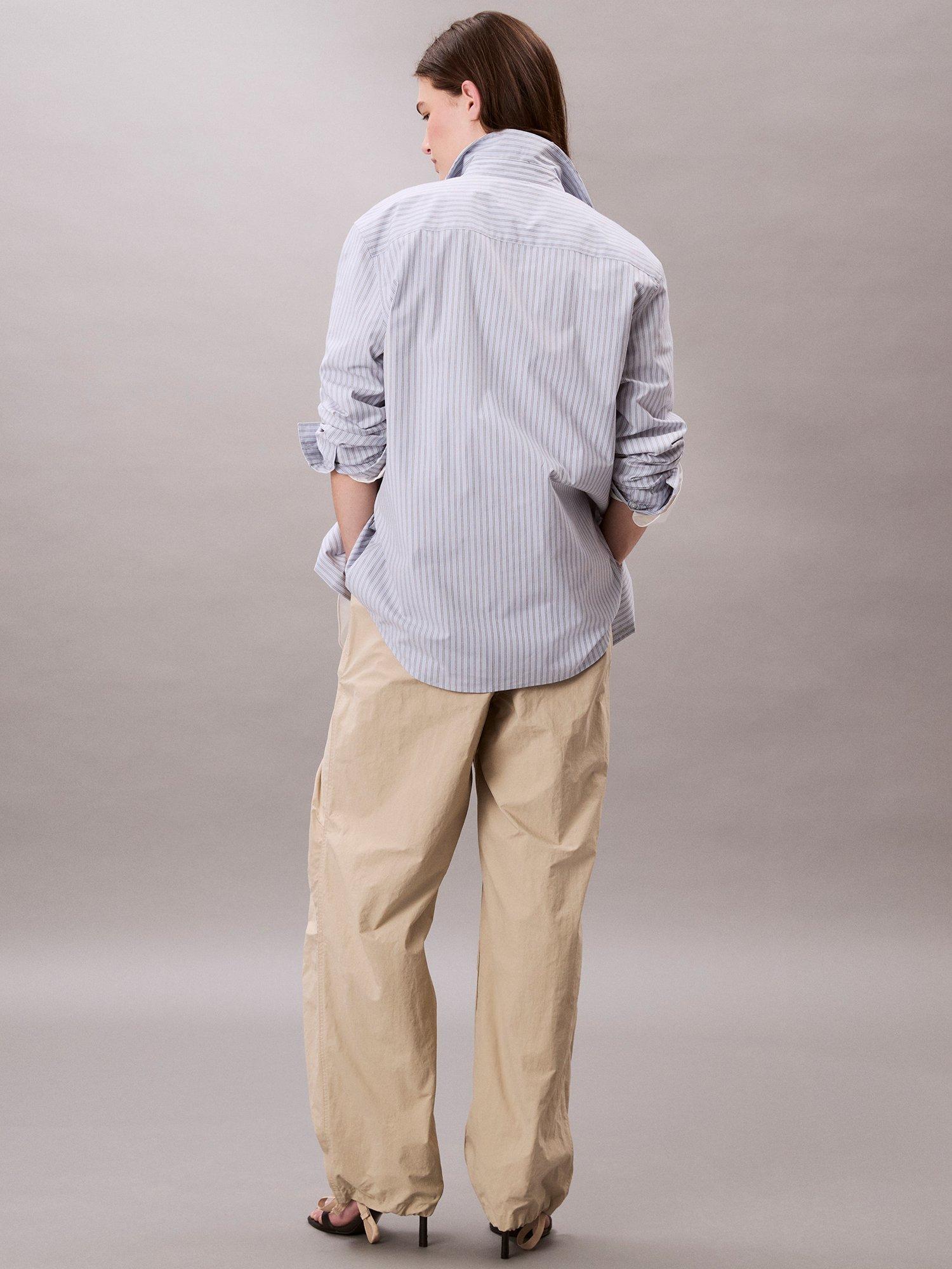 Product image 2 of 2, which shows Calvin Klein Crinkle Parachute Trousers, Off White, XS