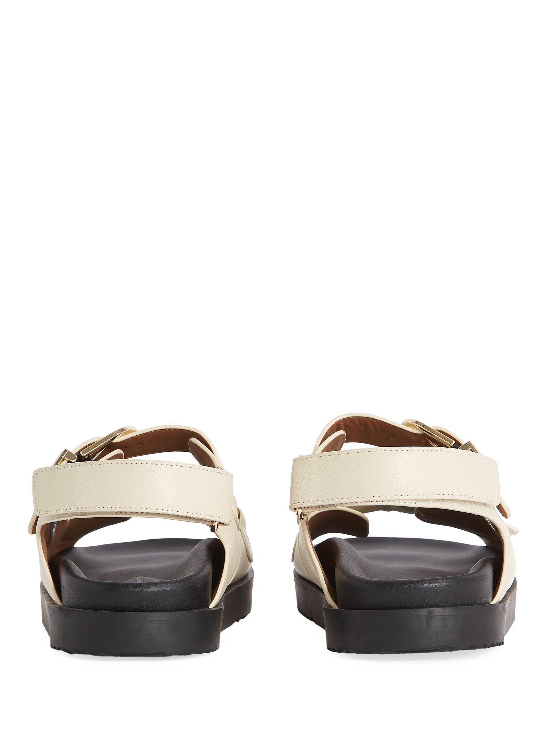 Product image 4 of 6, which shows Tommy Hilfiger TH Monogram Leather Cleat Sandals, Muslin, EU36