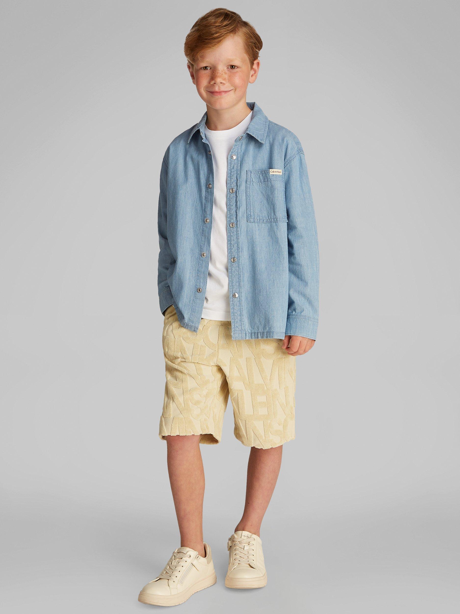 Product image 1 of 6, which shows Calvin Klein Kids' Relaxed Chambray Shirt, Azure Light, 8 years