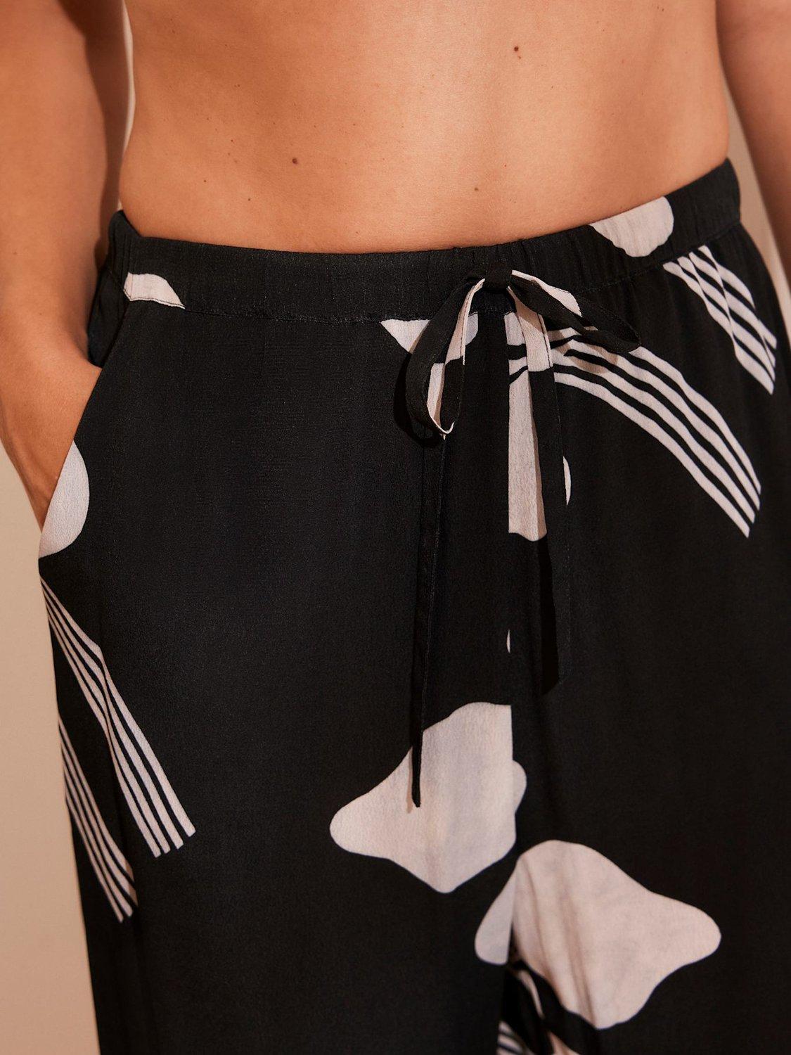 Product image 4 of 8, which shows Mint Velvet High Waist Graphic Print Trousers, Black/White, XS