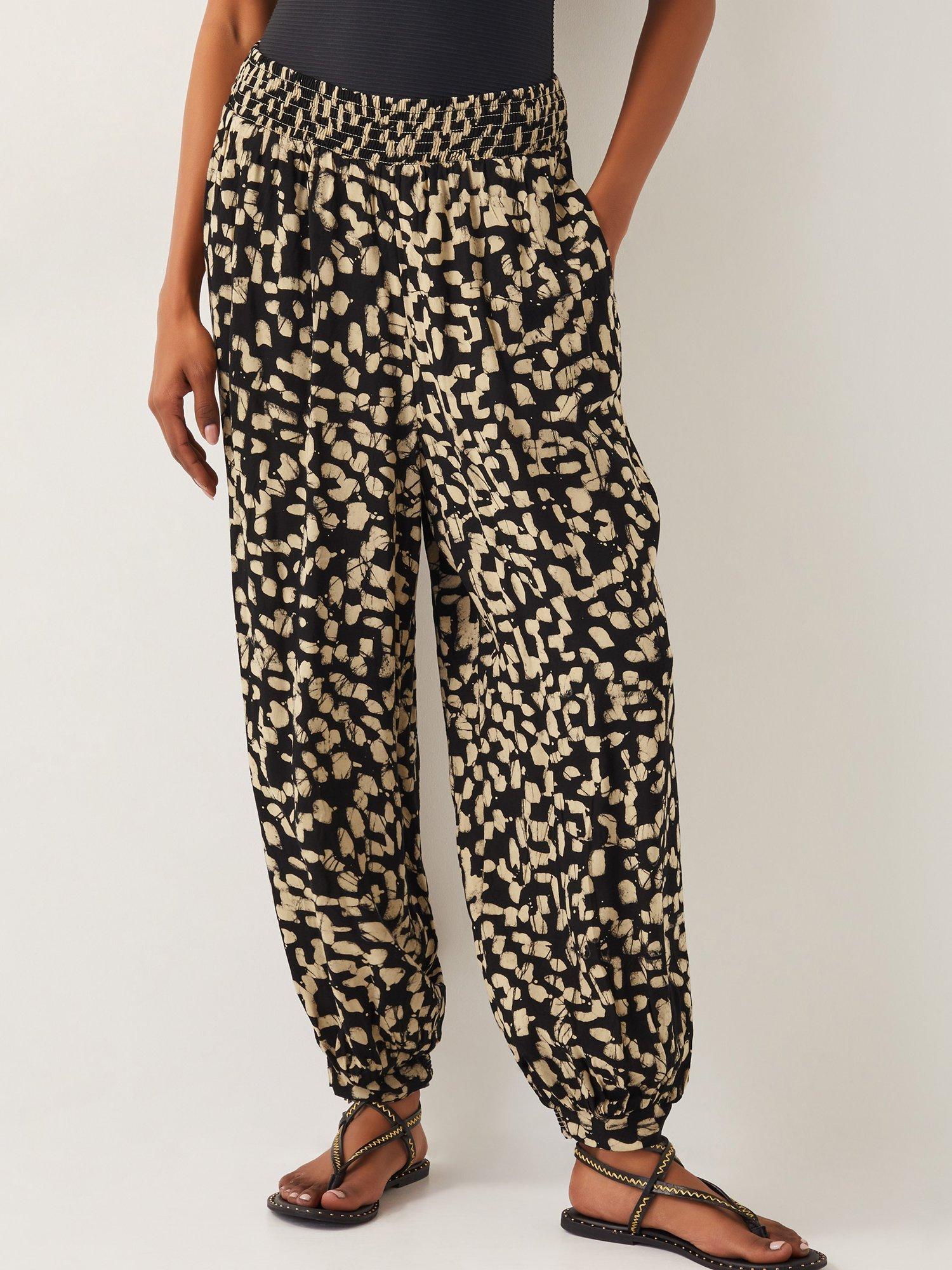 Product image 1 of 5, which shows Monsoon Ania Batik Print Trousers, Black, S