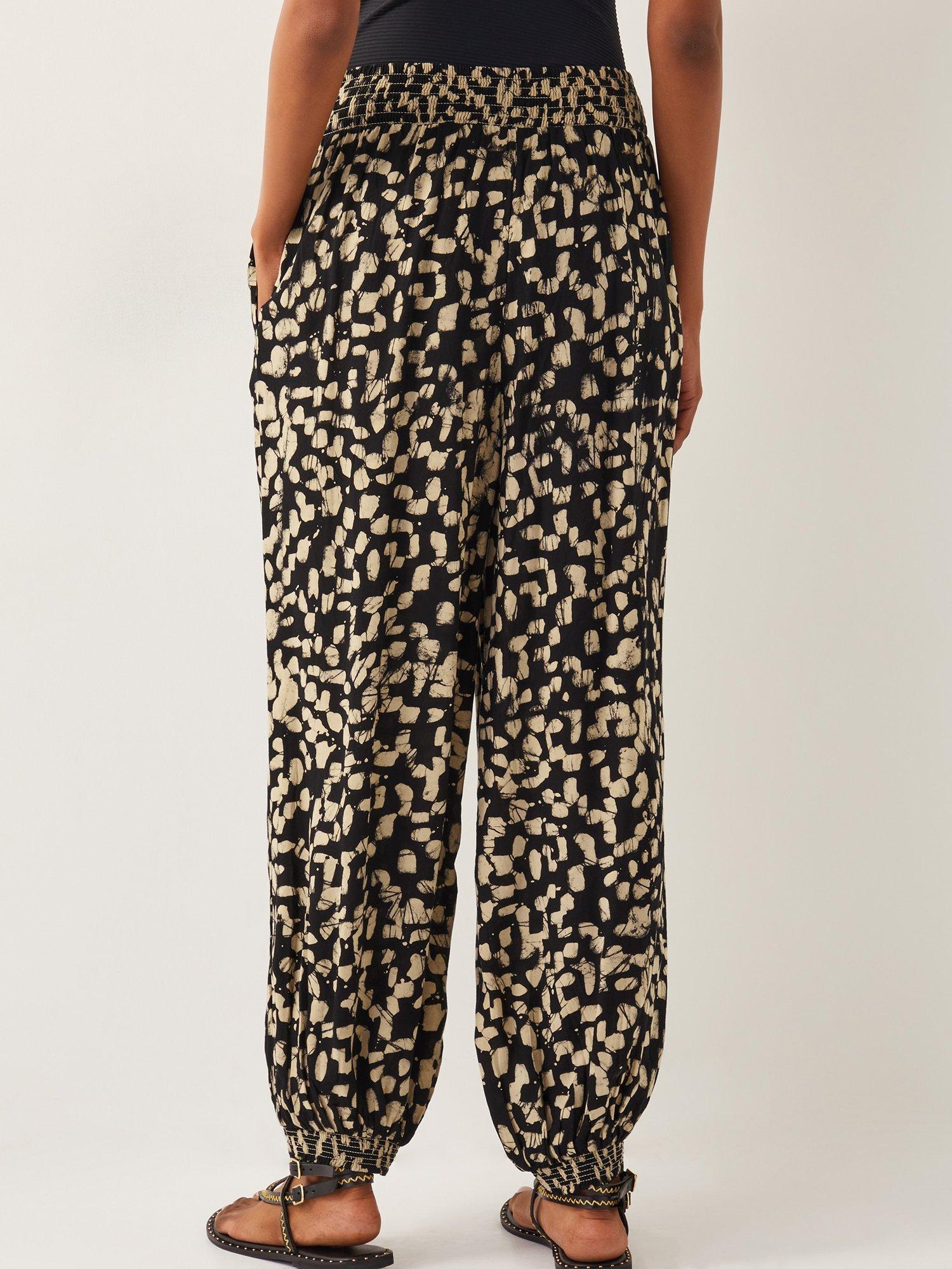Product image 2 of 5, which shows Monsoon Ania Batik Print Trousers, Black, S