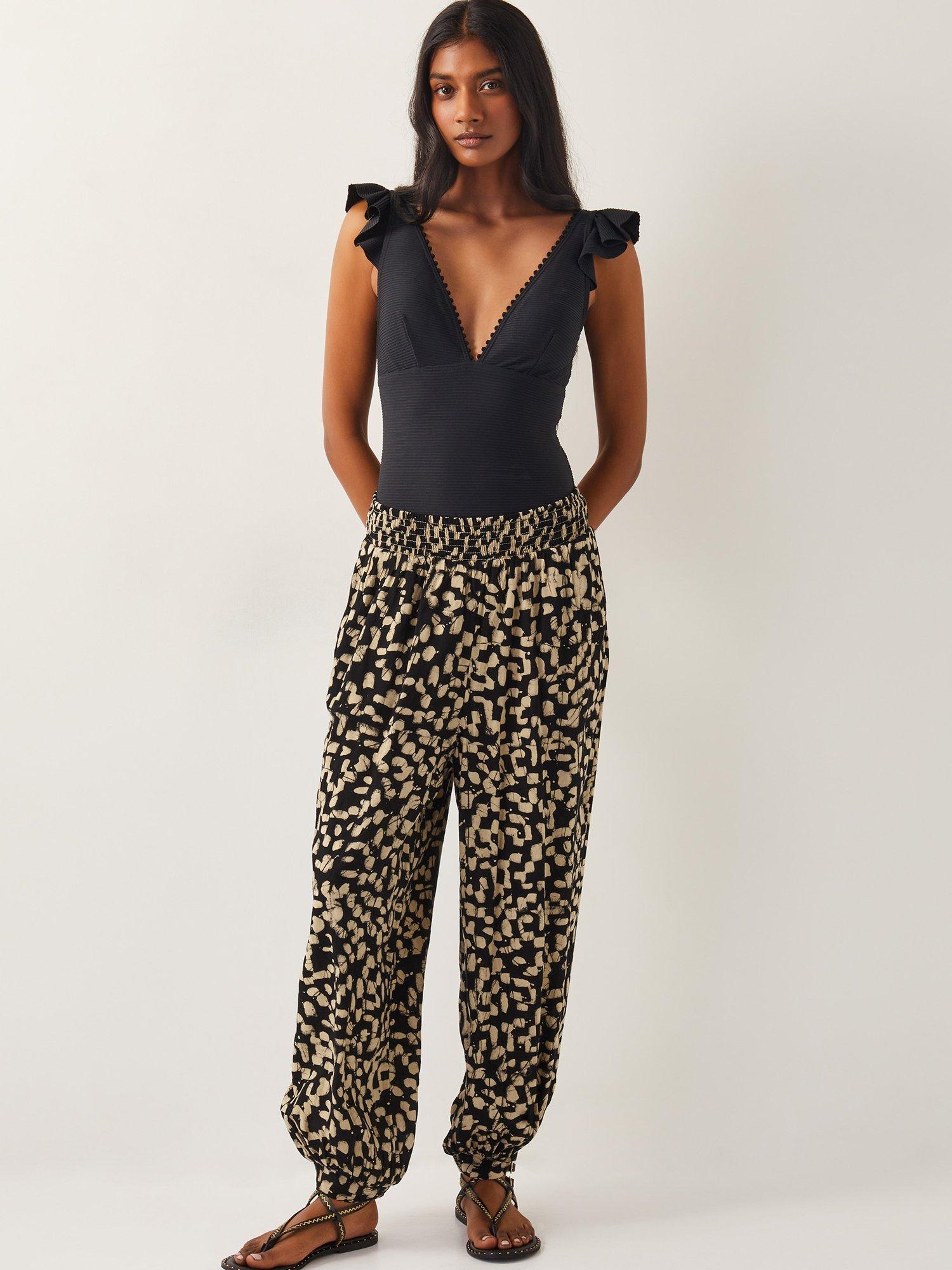 Product image 3 of 5, which shows Monsoon Ania Batik Print Trousers, Black, S