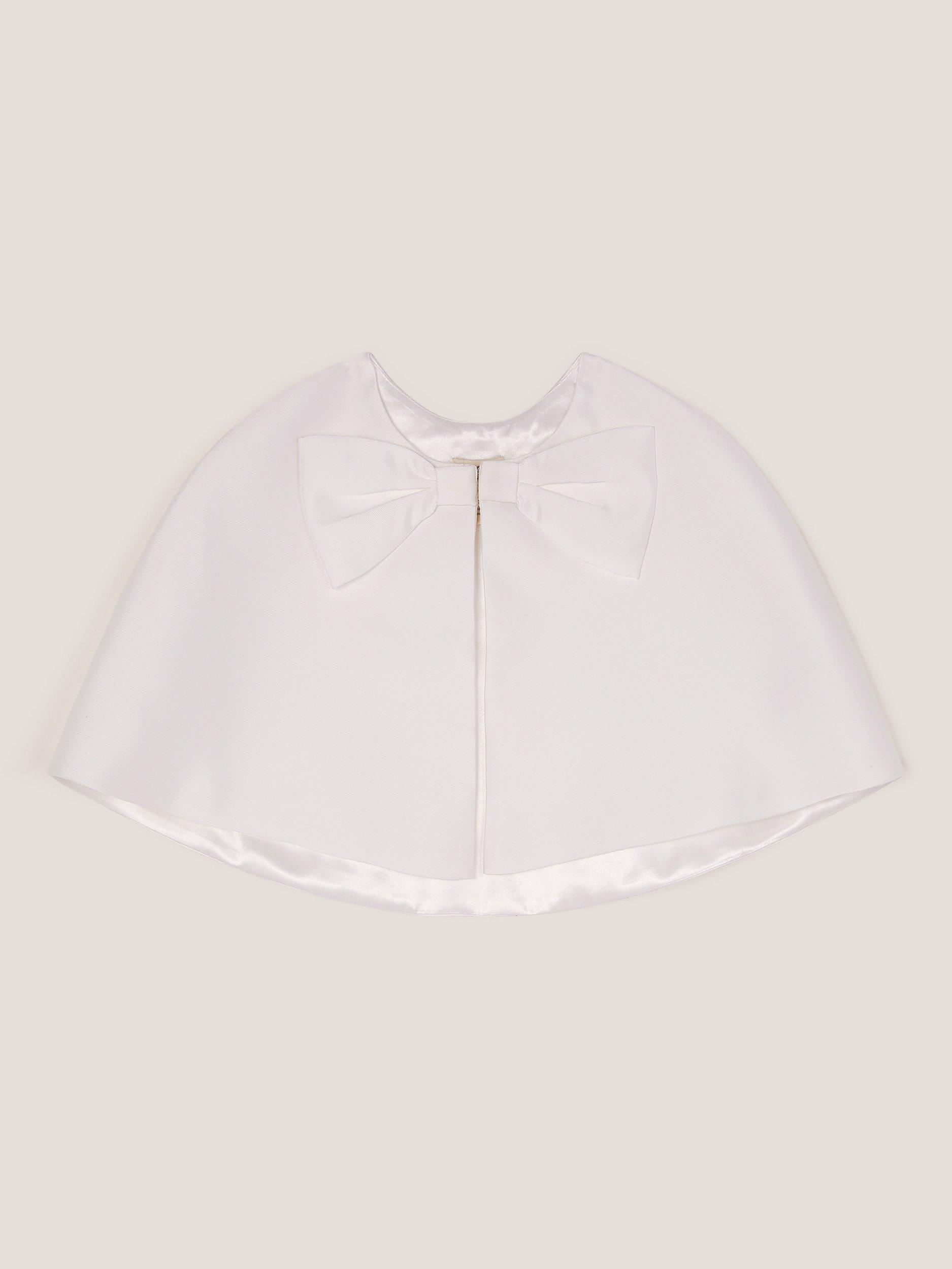 Product image 2 of 4, which shows Monsoon Kids' Bow Twill Cape , Ivory, 3-6 years