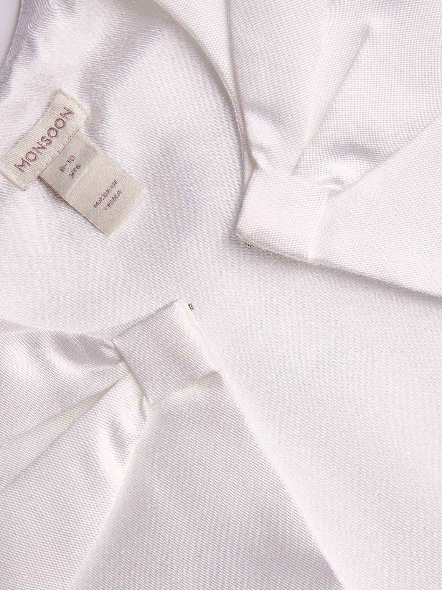 Product image 4 of 4, which shows Monsoon Kids' Bow Twill Cape , Ivory, 3-6 years
