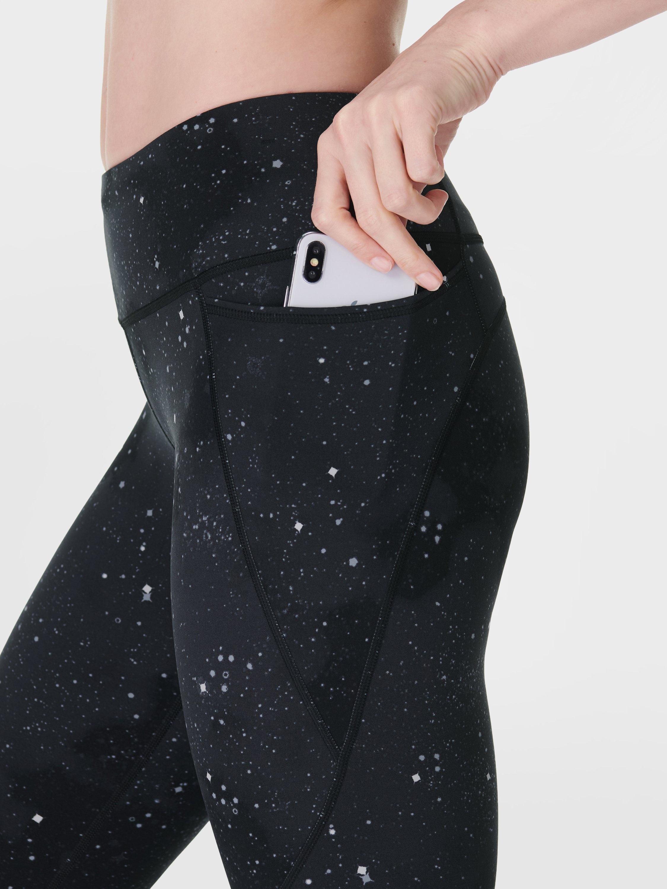 Product image 6 of 9, which shows Sweaty Betty Power 7/8 Workout Leggings, Ultra Black Ditsy Star Print, XXS