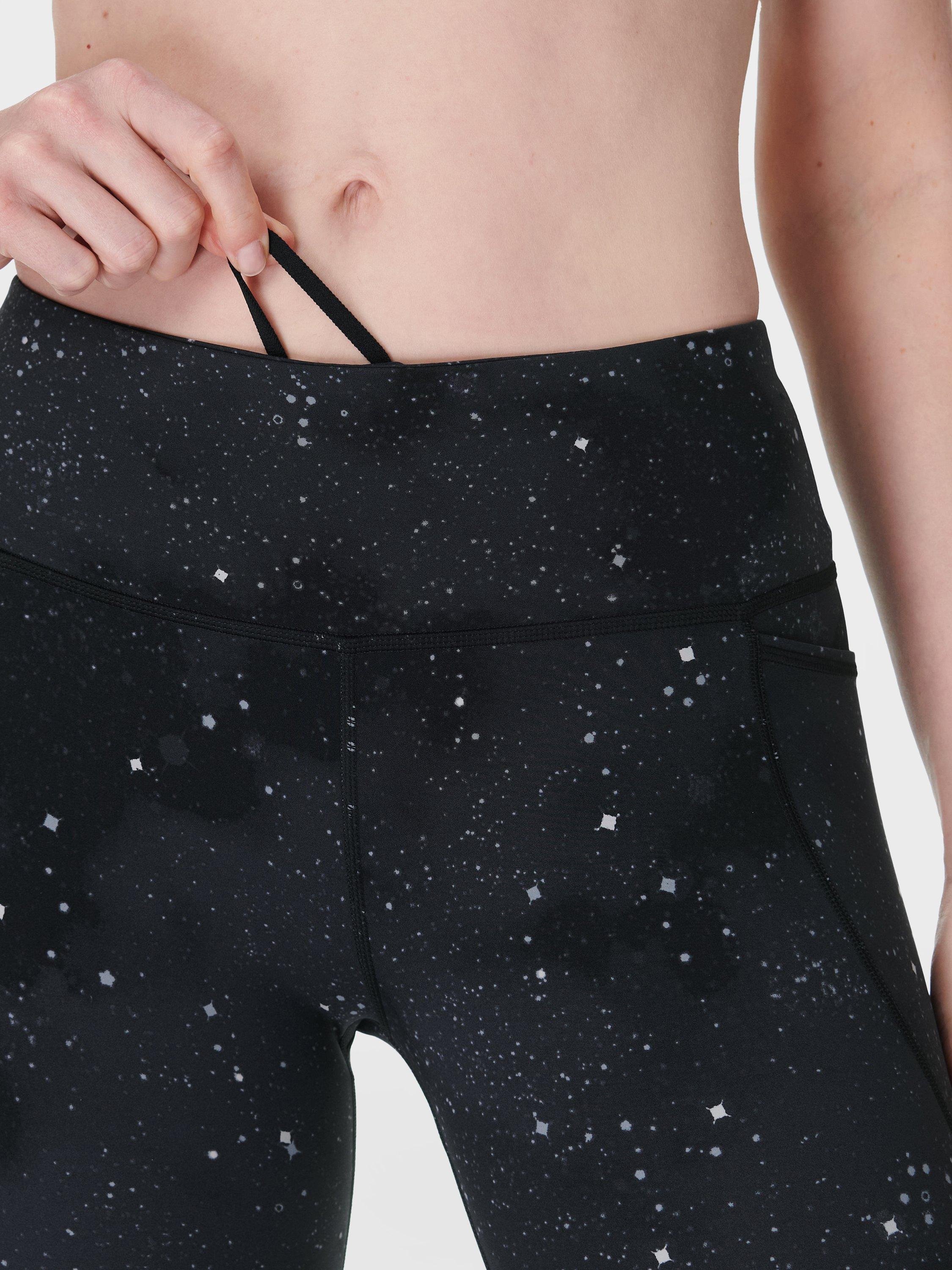 Product image 8 of 9, which shows Sweaty Betty Power 7/8 Workout Leggings, Ultra Black Ditsy Star Print, XXS