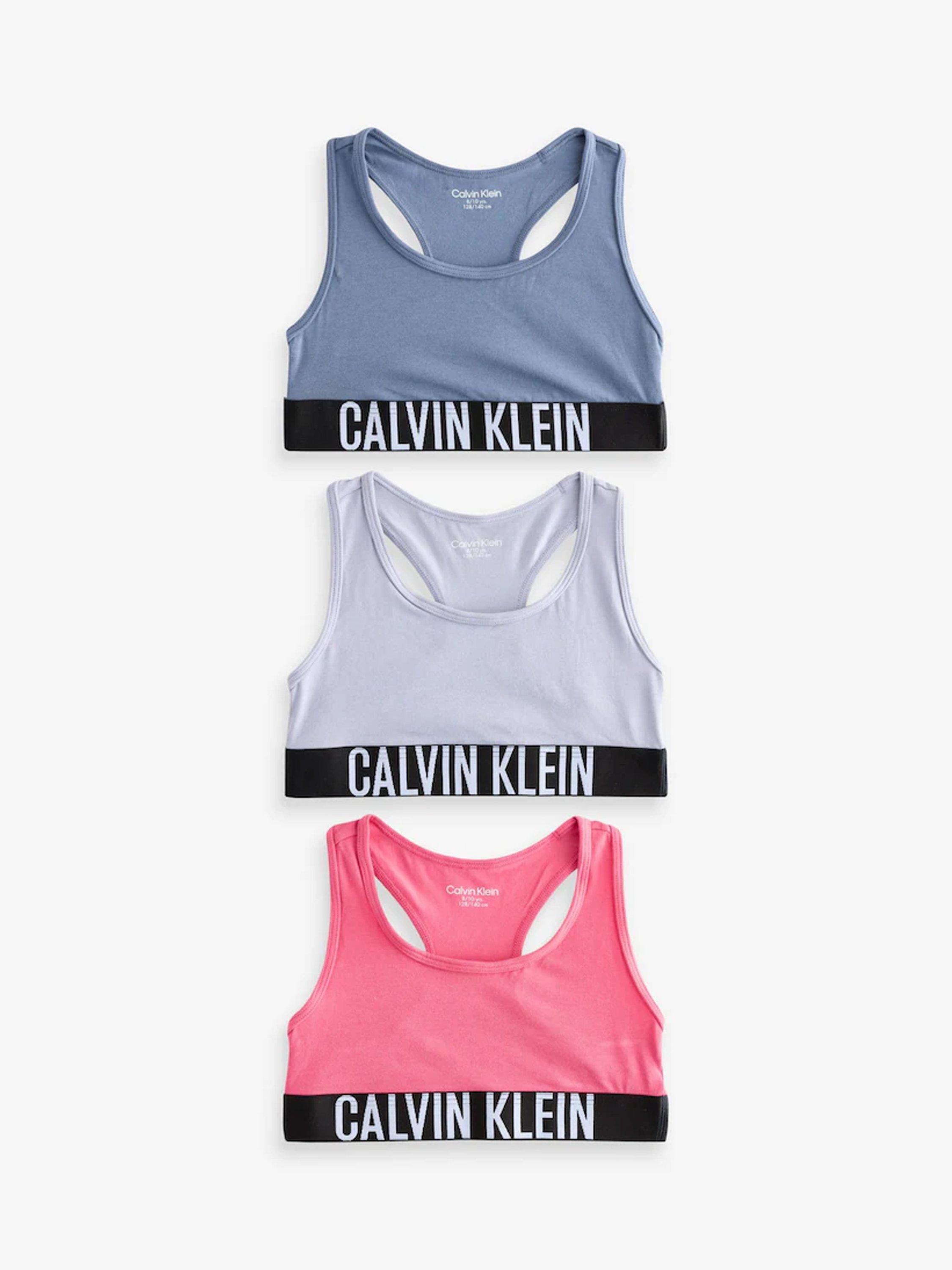 Product image 1 of 1, which shows Calvin Klein Kids' Intense Power Bralette, Pack of 3, Crmsfr/Lilacgry/Gris, 8-10 years