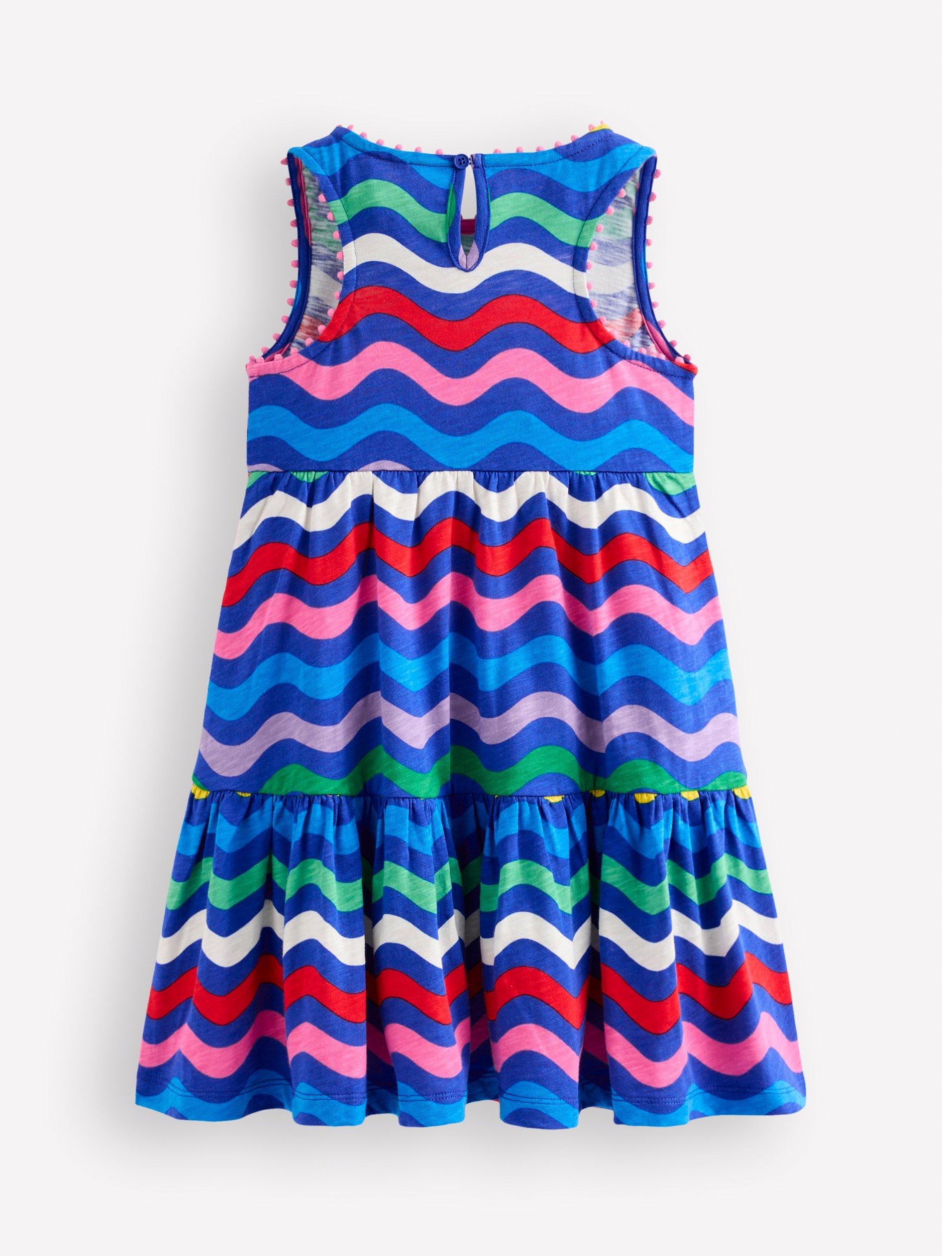 Product image 2 of 3, which shows Mini Boden Kids' Ali Pom Trim Jersey Dress, Blue Wave Stripe, 2-3 years