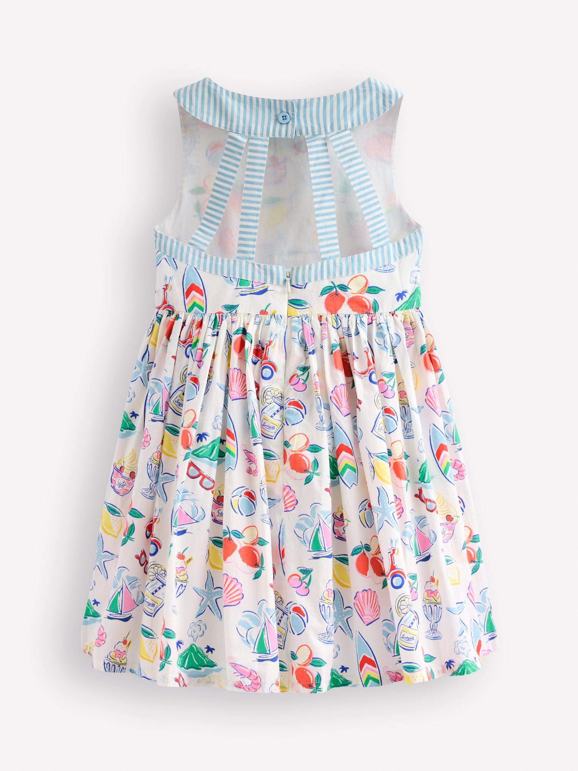Product image 2 of 3, which shows Mini Boden Kids' Harlow Strappy Back Cotton Dress, Ivory Holiday Print, 2-3 years