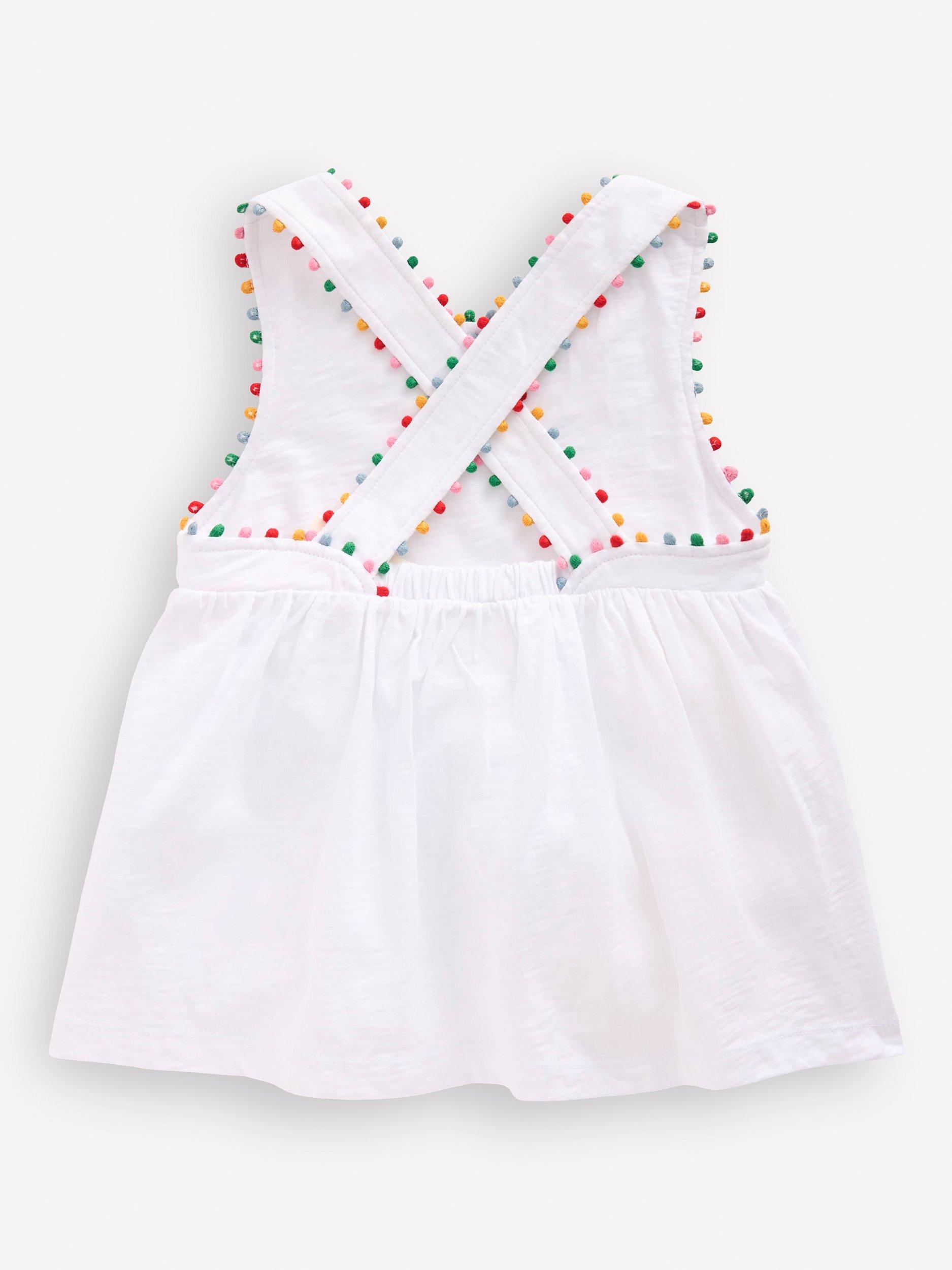 Product image 2 of 3, which shows Mini Boden Kids' Cross-Back Pom Pom Top, White, 2-3 years