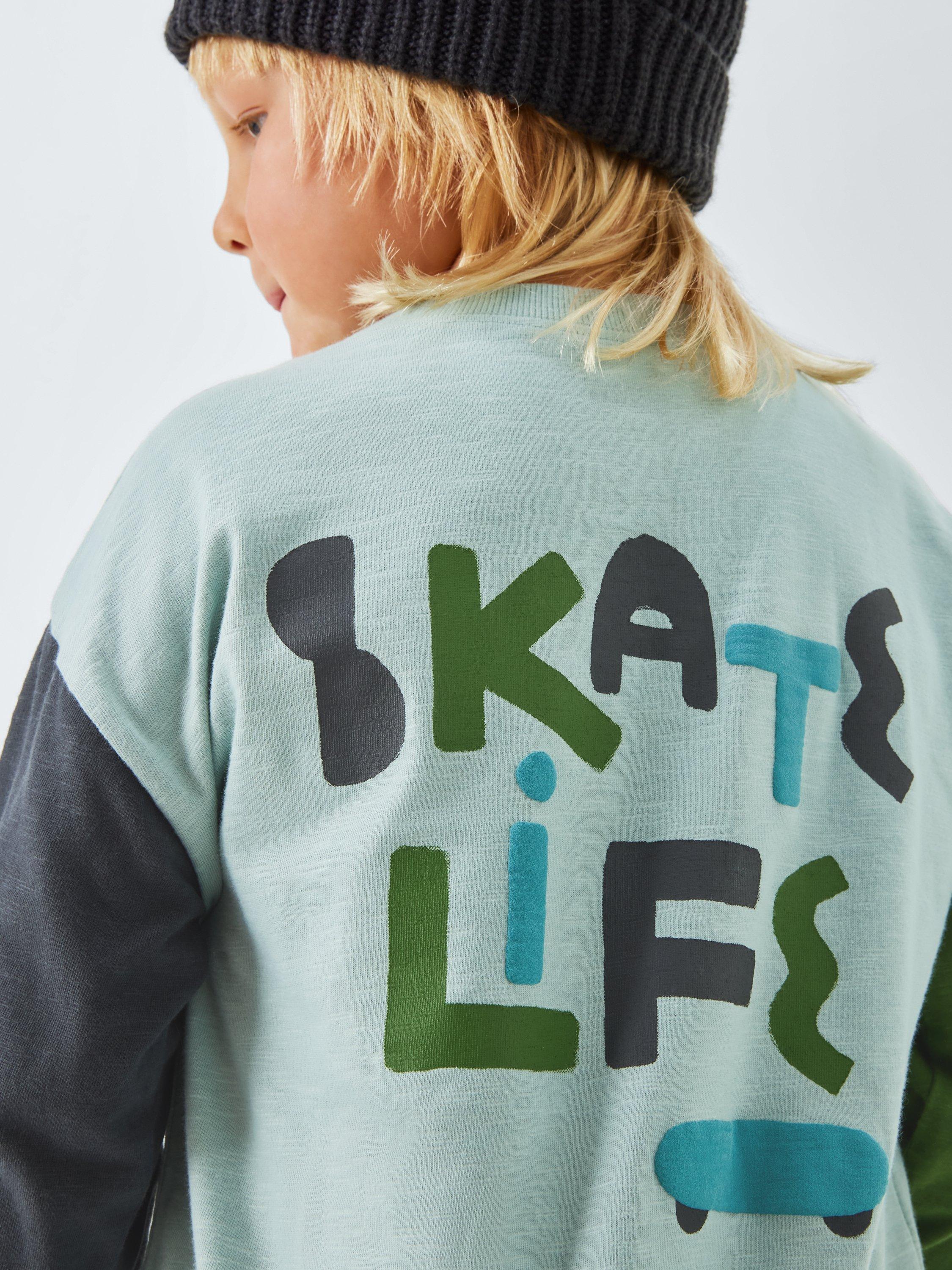 Product image 5 of 7, which shows John Lewis Kids' Skate Graphic Jersey Top, Light Blue, 3 years
