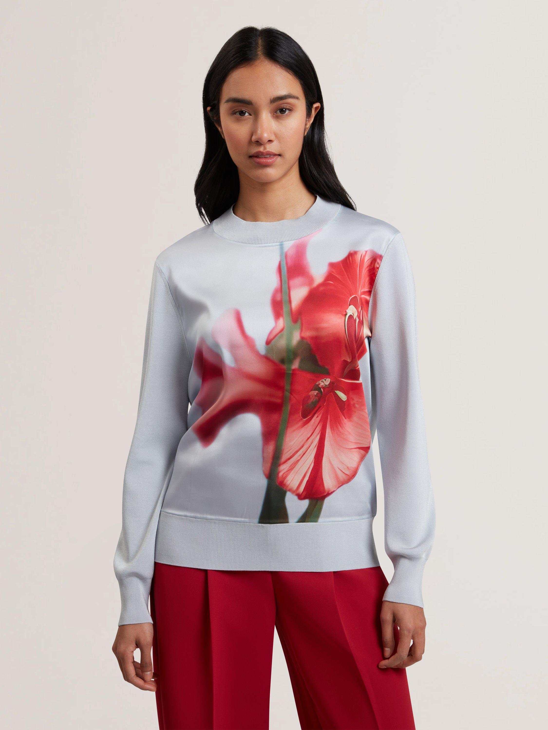 Product image 1 of 6, which shows Ted Baker Eloaa Satin Woven Floral Knit Top, Pale Blue/Red, 6
