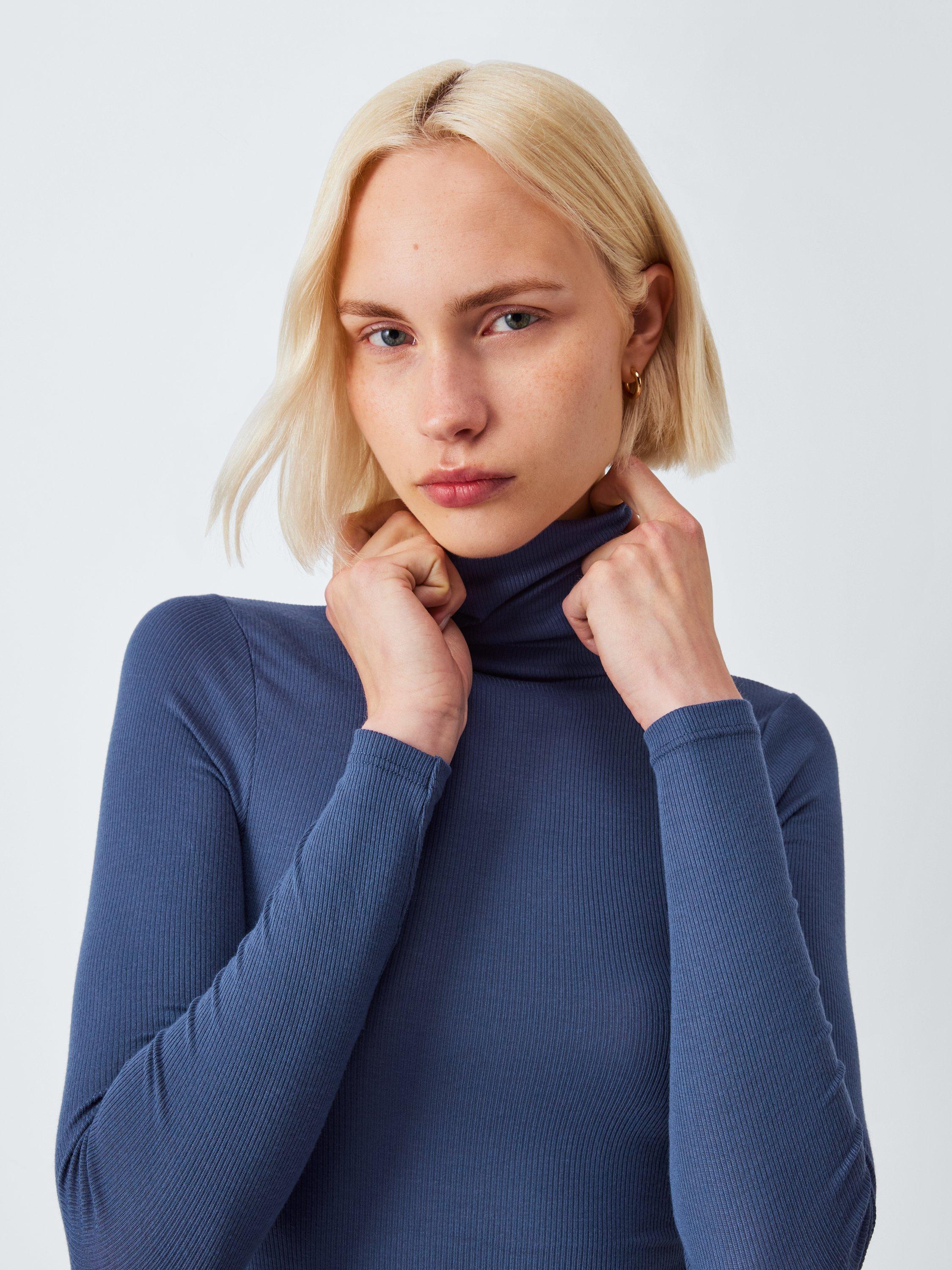 Product image 4 of 5, which shows John Lewis Heat Generating Ribbed Roll Neck Thermal Top, Mid Blue, 8-10