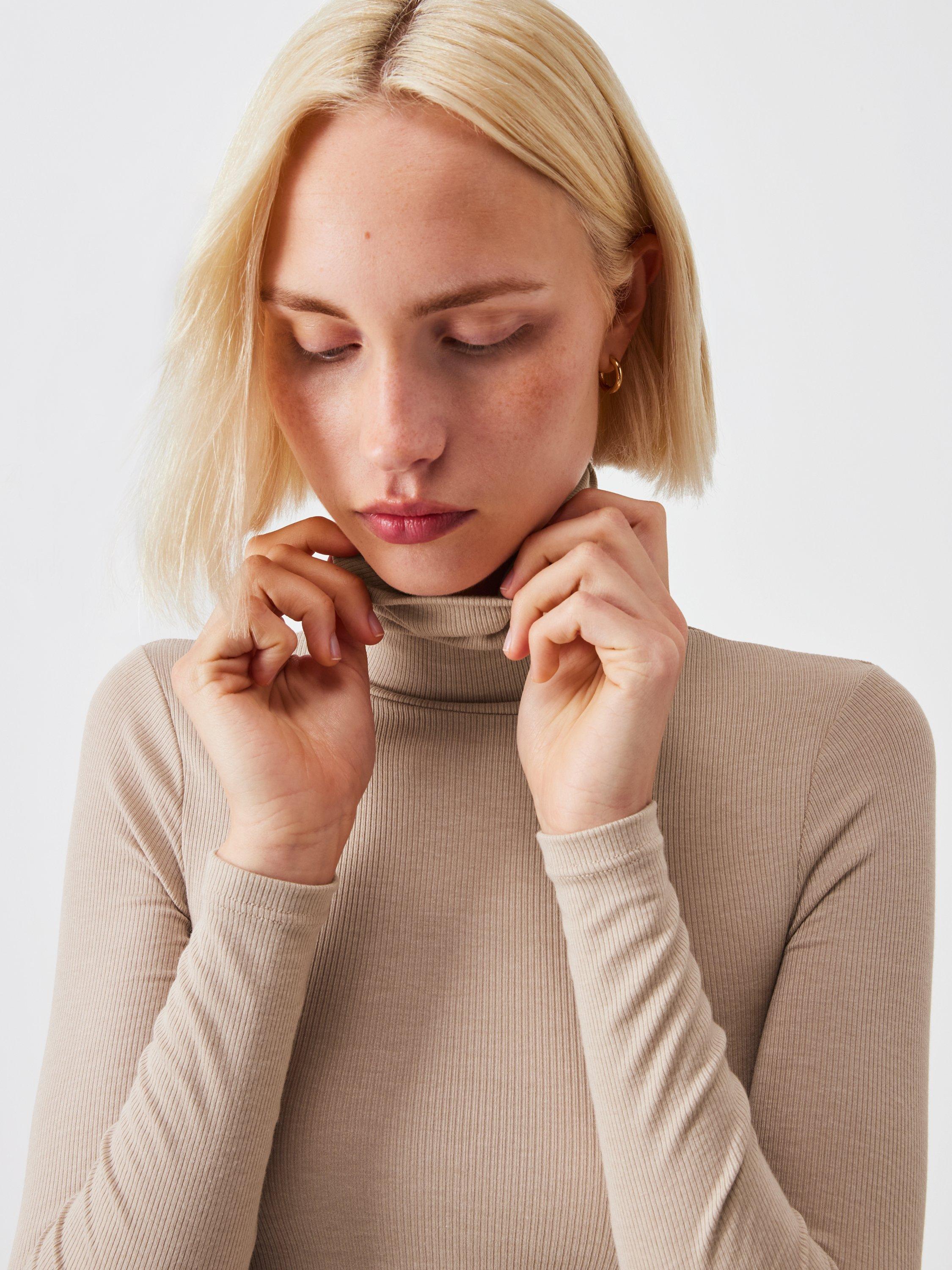 Product image 4 of 5, which shows John Lewis Heat Generating Ribbed Roll Neck Thermal Top, Oatmeal, 8-10