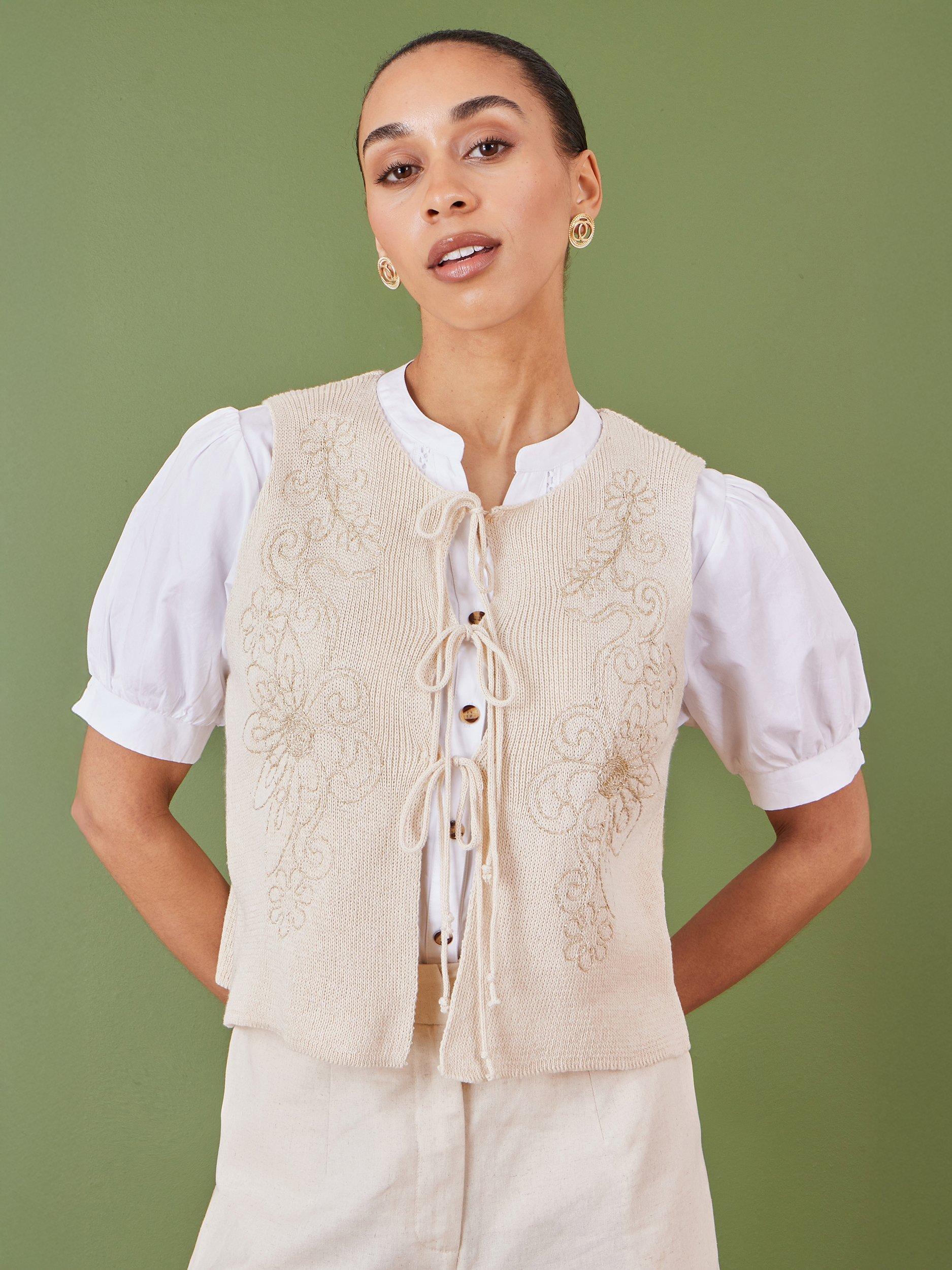 Product image 1 of 5, which shows Yumi Floral Knit Tie Front Waistcoat, Beige, S