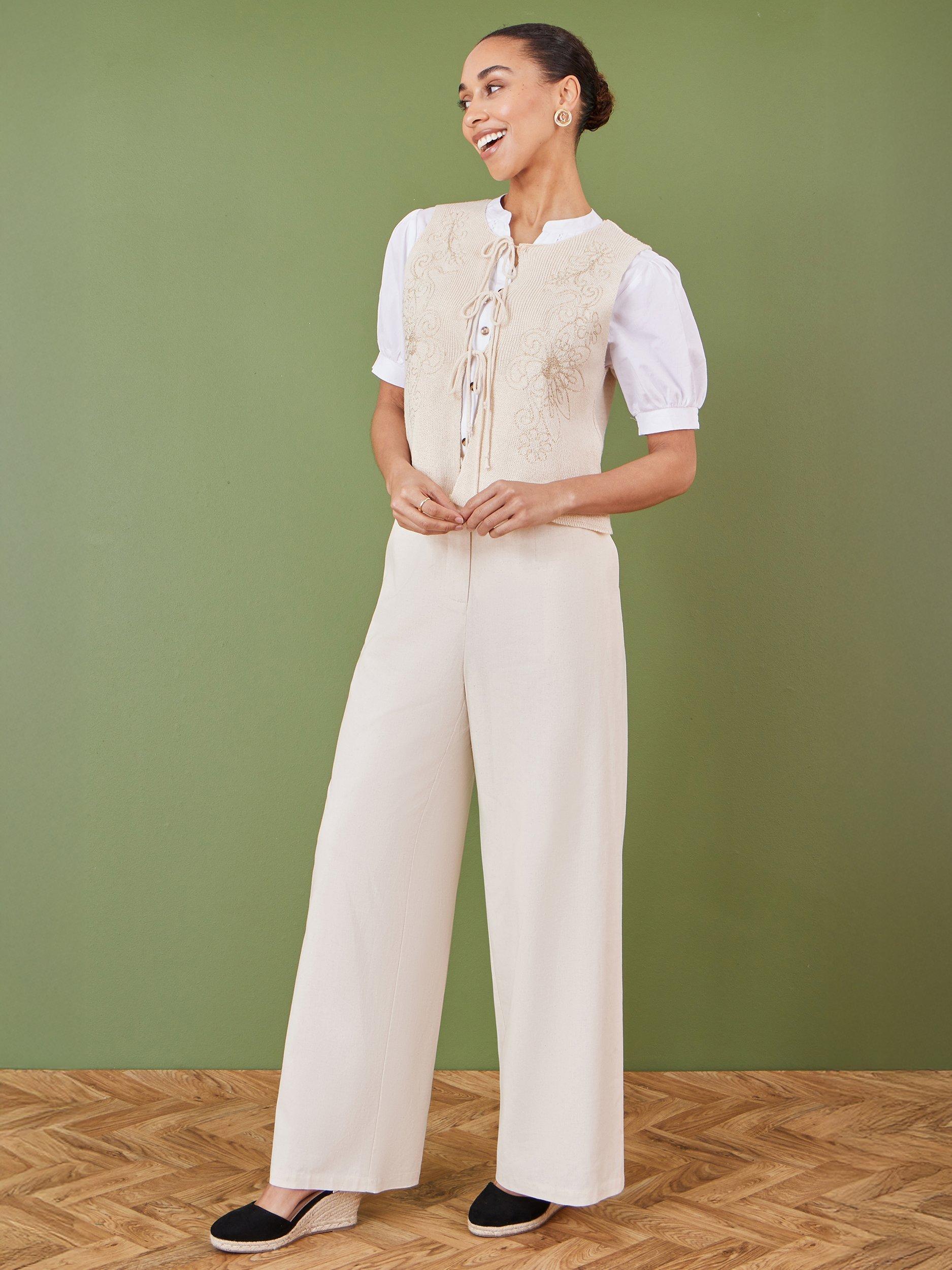 Product image 2 of 5, which shows Yumi Floral Knit Tie Front Waistcoat, Beige, S