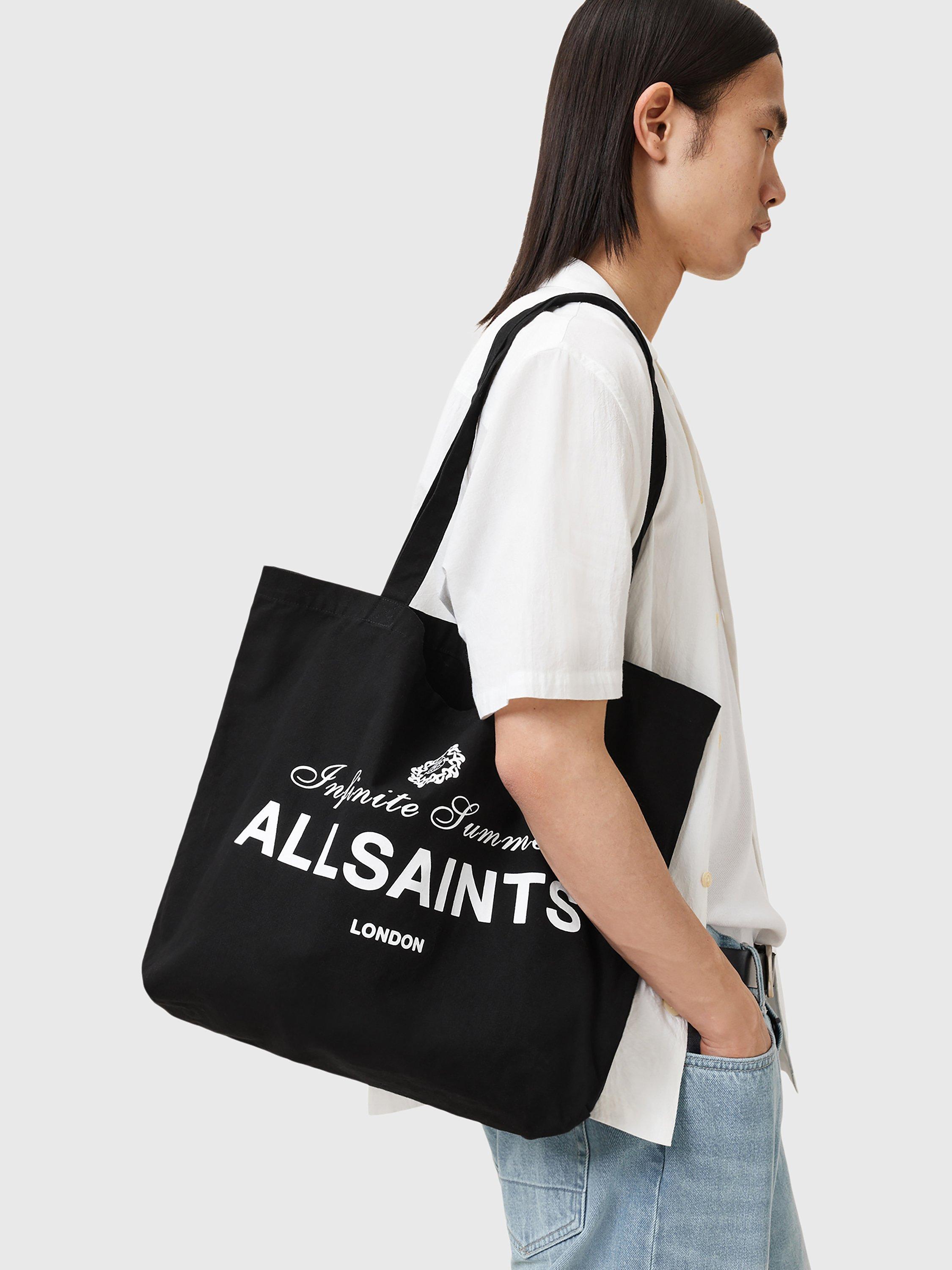 Product image 2 of 7, which shows AllSaints Soleil Grpahic Canvas Tote Bag, Washed Black