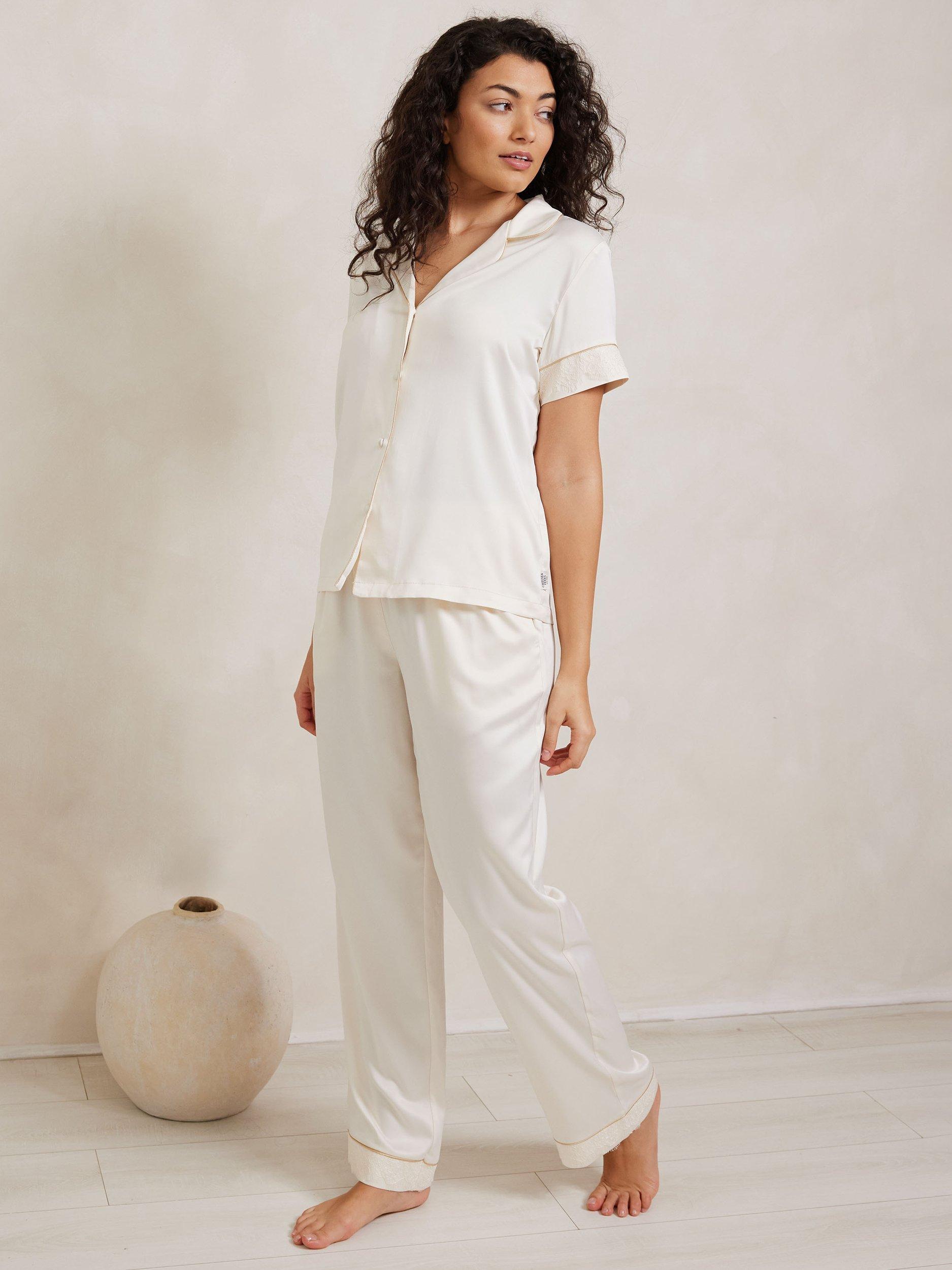Product image 1 of 5, which shows Chelsea Peers Satin Lace Trim Pyjama Set, Ivory, 6