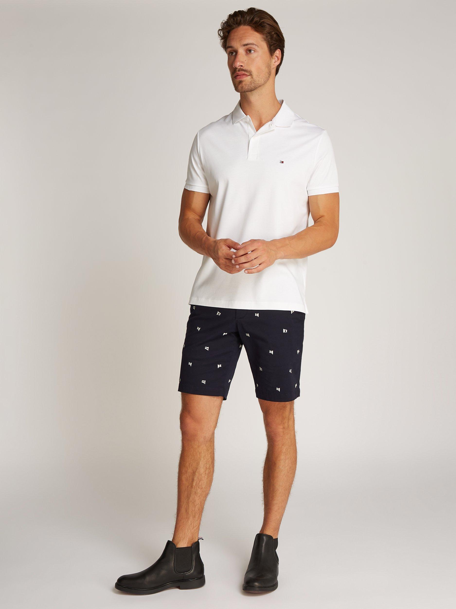Product image 1 of 7, which shows Tommy Hilfiger Liquid Cotton Blend Regular Fit Short Sleeve Polo Shirt, White, XS