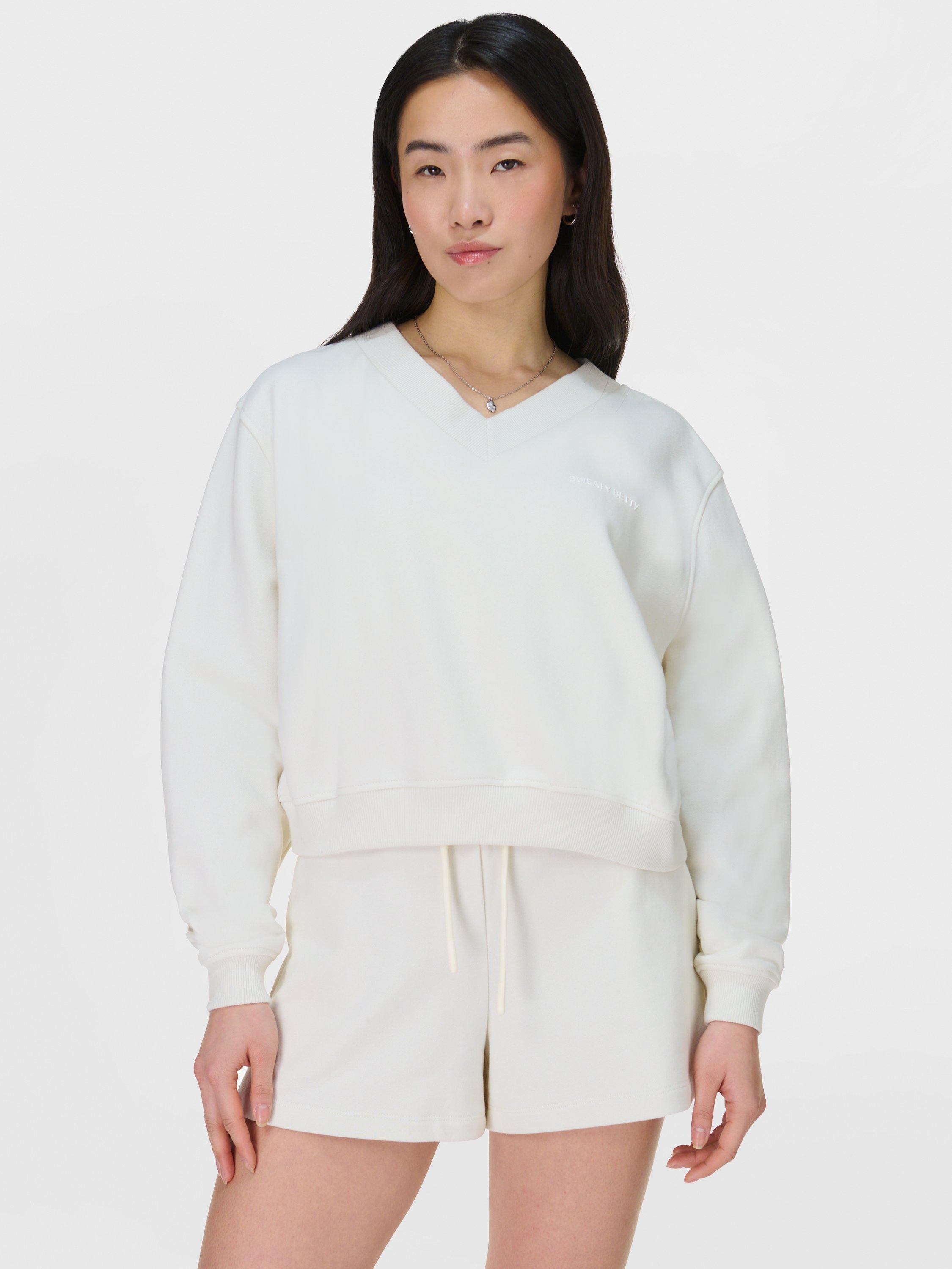 Product image 1 of 7, which shows Sweaty Betty Revive Organic Cotton Rich Cropped Jumper, Lily White, XXS-XS