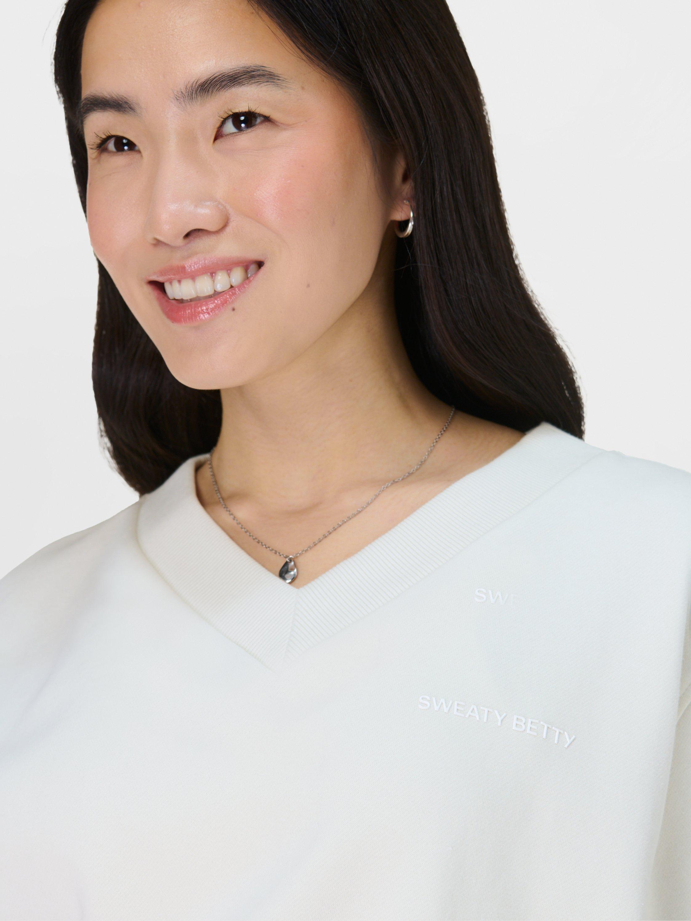 Product image 6 of 7, which shows Sweaty Betty Revive Organic Cotton Rich Cropped Jumper, Lily White, XXS-XS