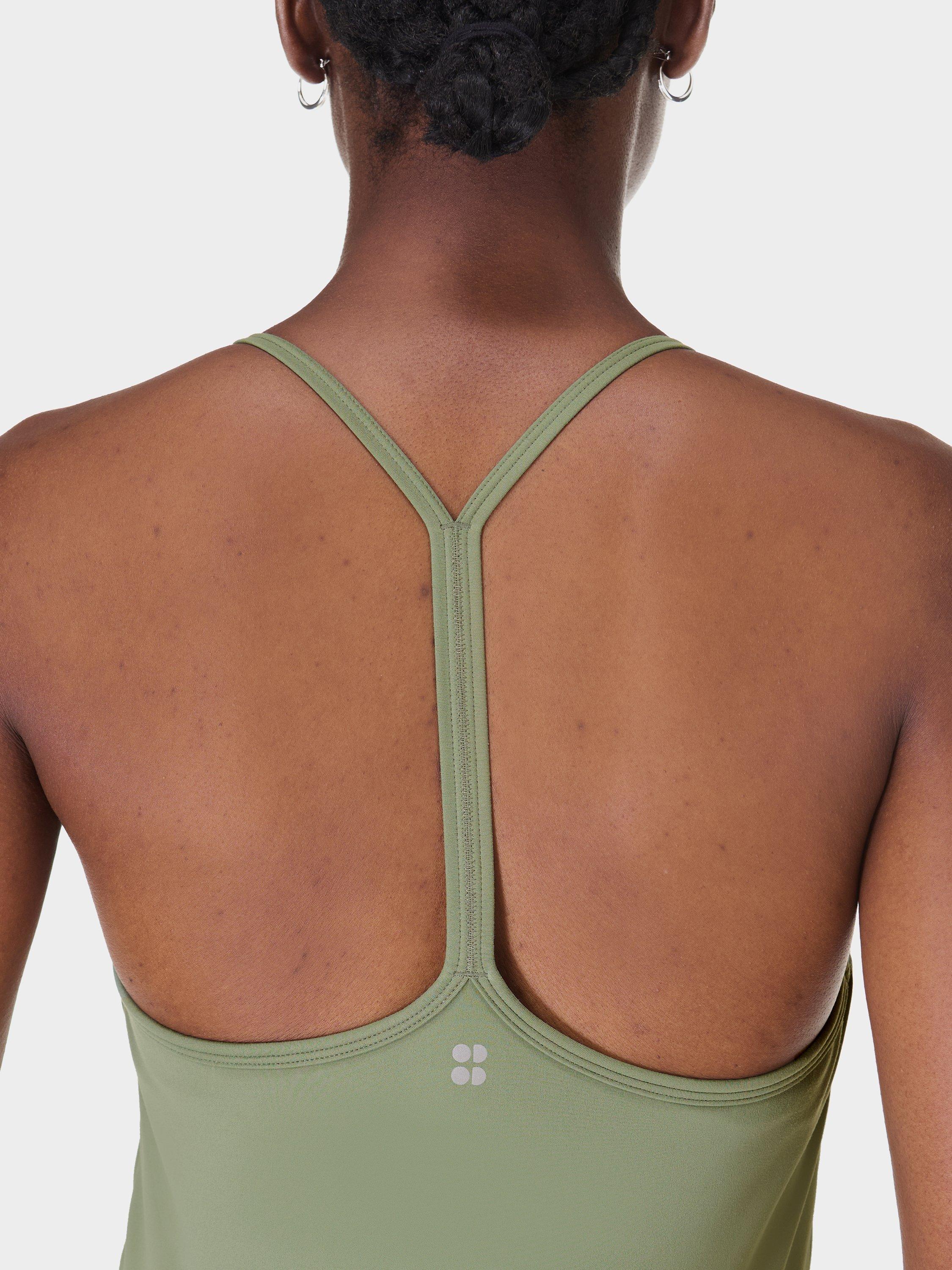 Product image 5 of 9, which shows Sweaty Betty Soft Flow 2-in-1 Bra Tank Top, Willow Green, XXS